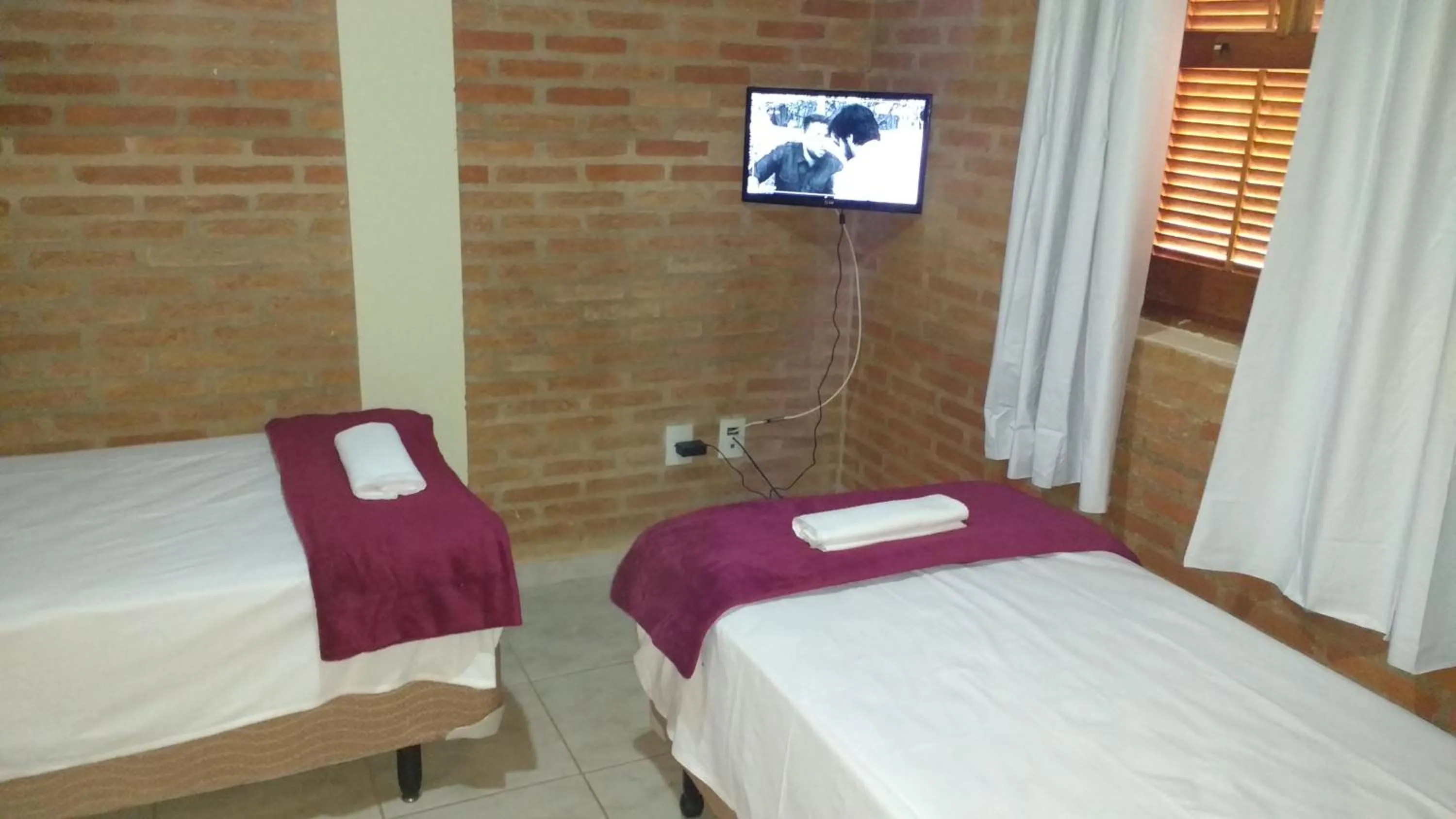Photo of the whole room, Bed in Aconchego do Guara , próximo ao centro médico, Boldrini, Unicamp, Laboratório CNPEN, Universidades e Hospital Sobrapar