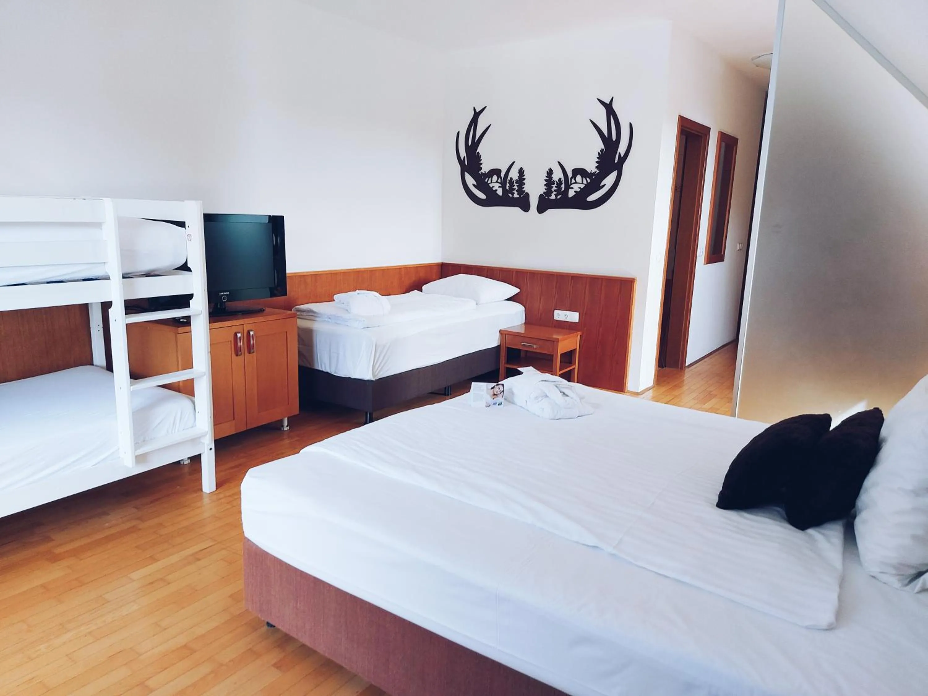 Bedroom, Bed in Pohorje Village Wellbeing Resort - Wellness & Spa Hotel Bolfenk