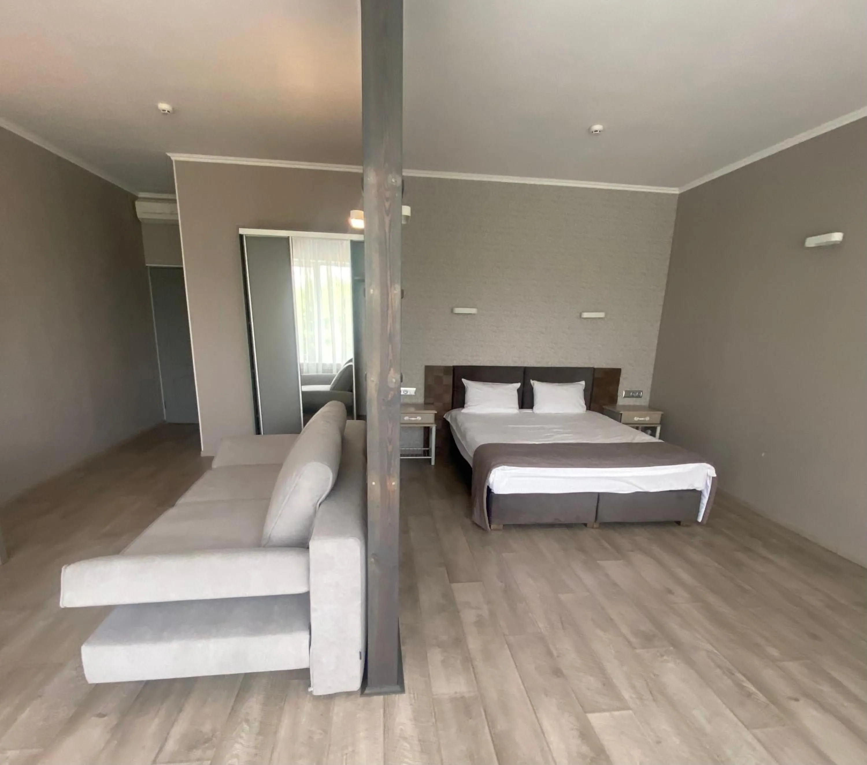 Seating area, Bed in Pallada Hotel