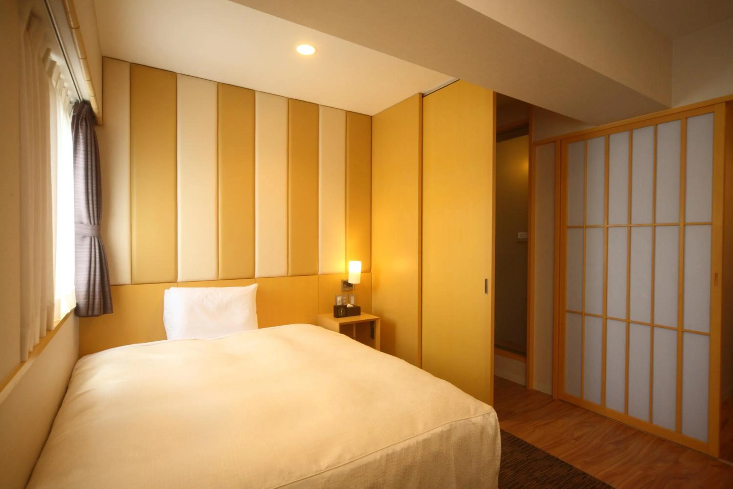 Bed in Hotel Sunroute Kumamoto