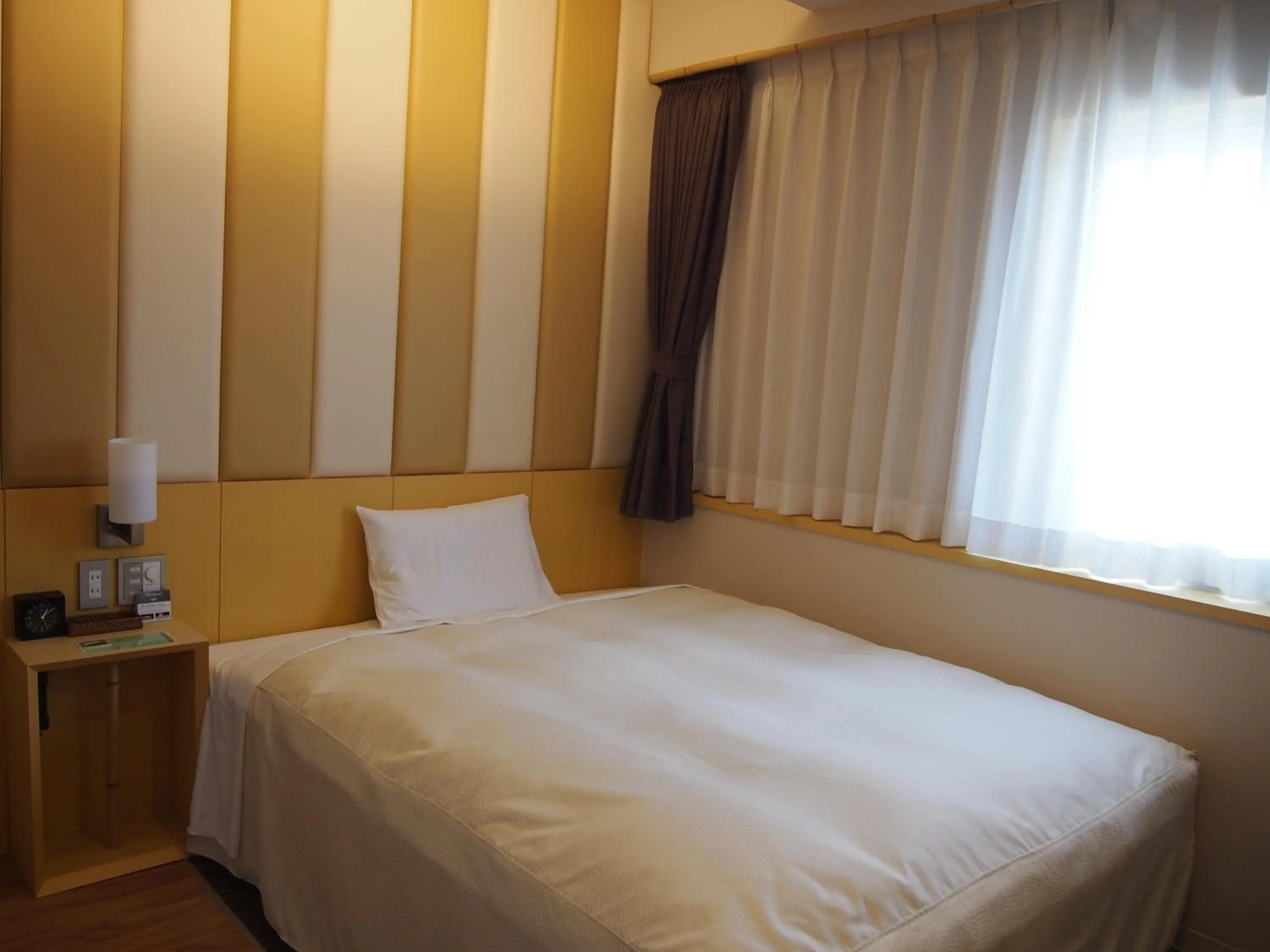 Decorative detail, Bed in Hotel Sunroute Kumamoto