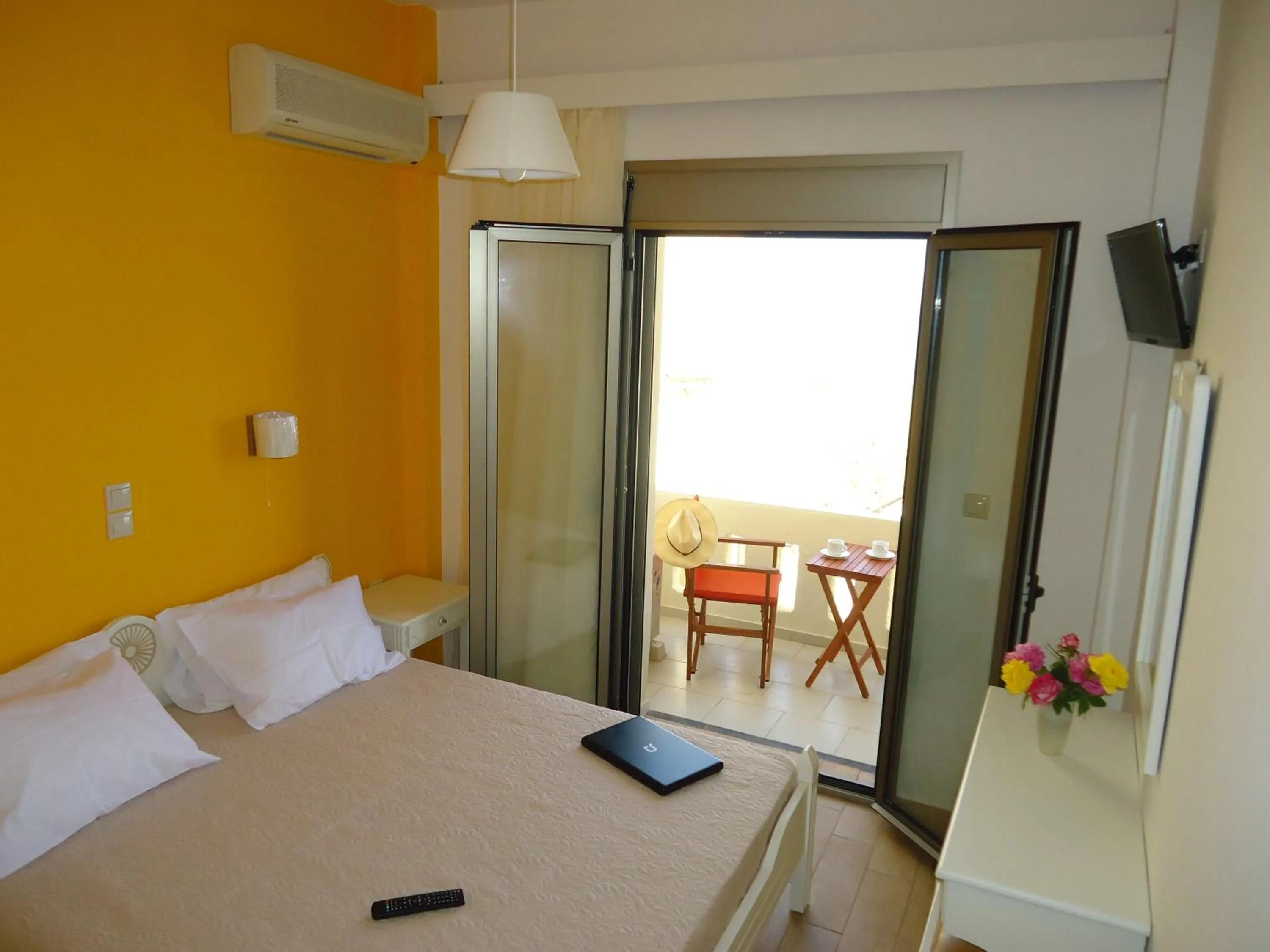 Bed in Almyra Apartments & Suites