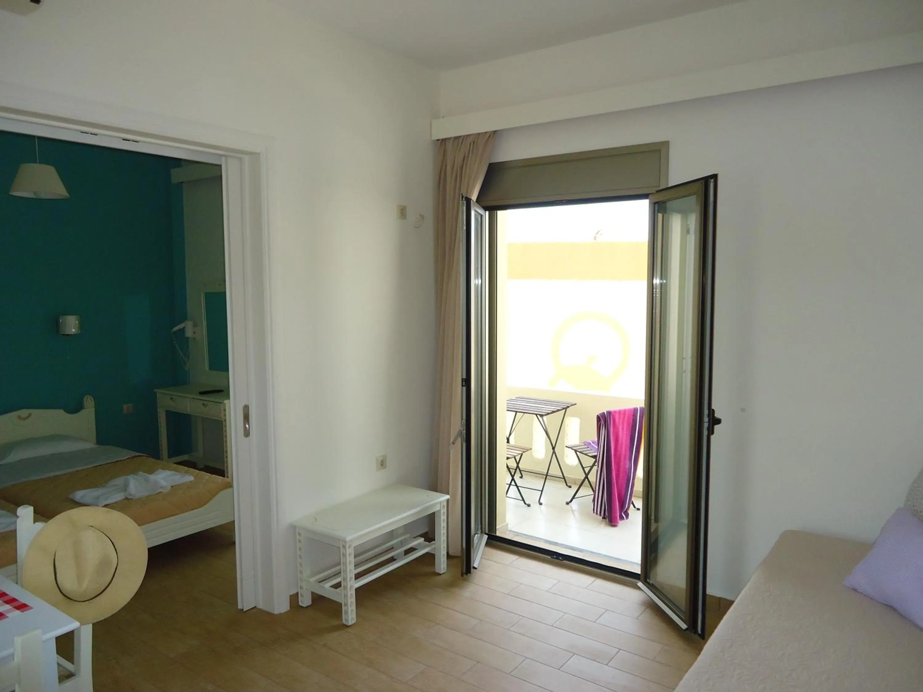 Balcony/Terrace, Bed in Almyra Apartments & Suites