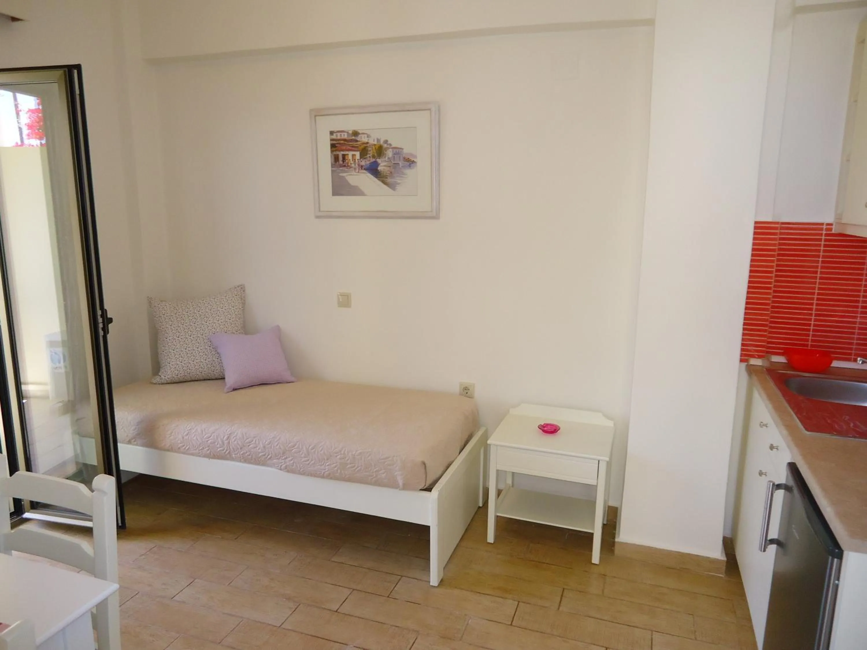 Bed in Almyra Apartments & Suites