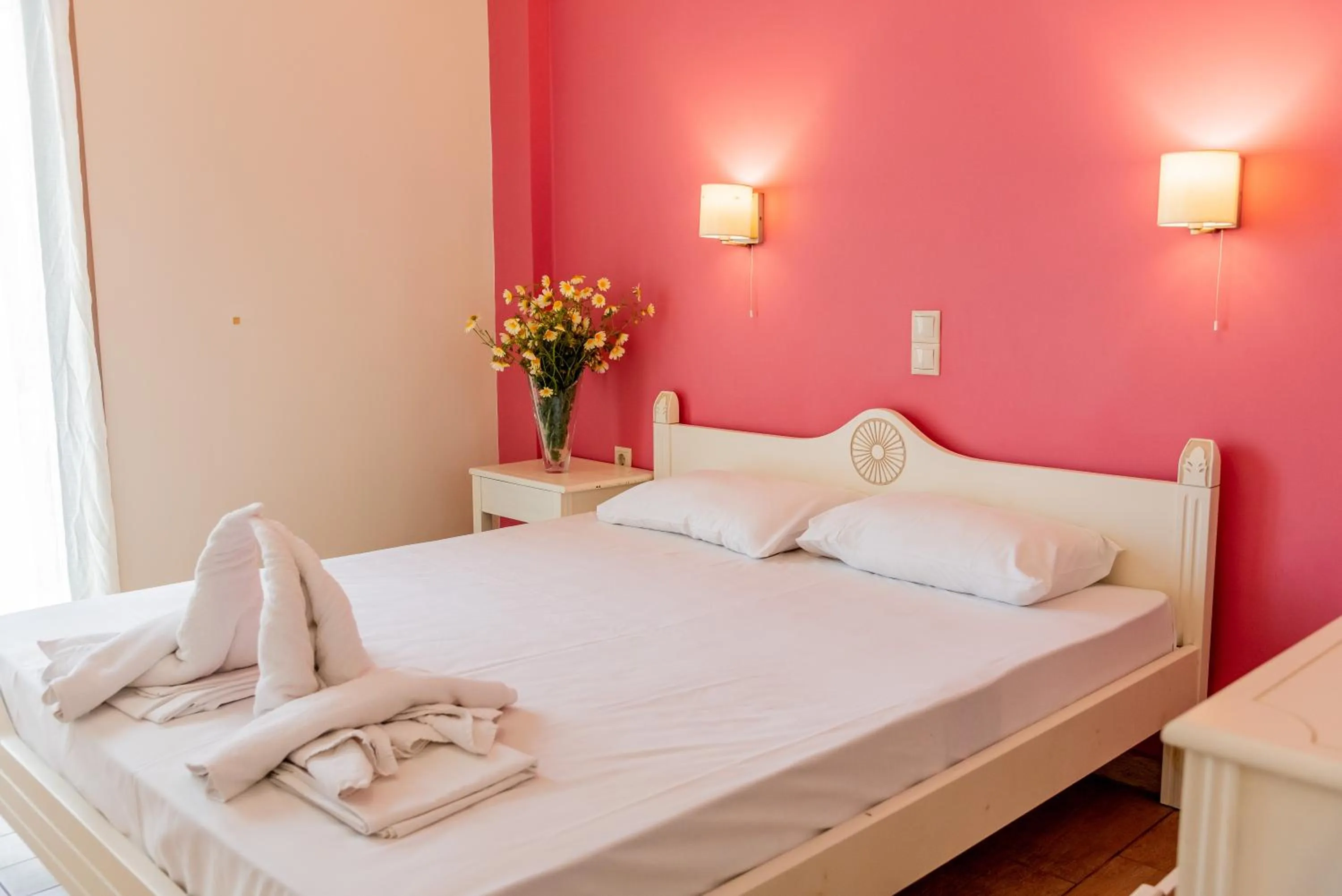 Bed in Almyra Apartments & Suites