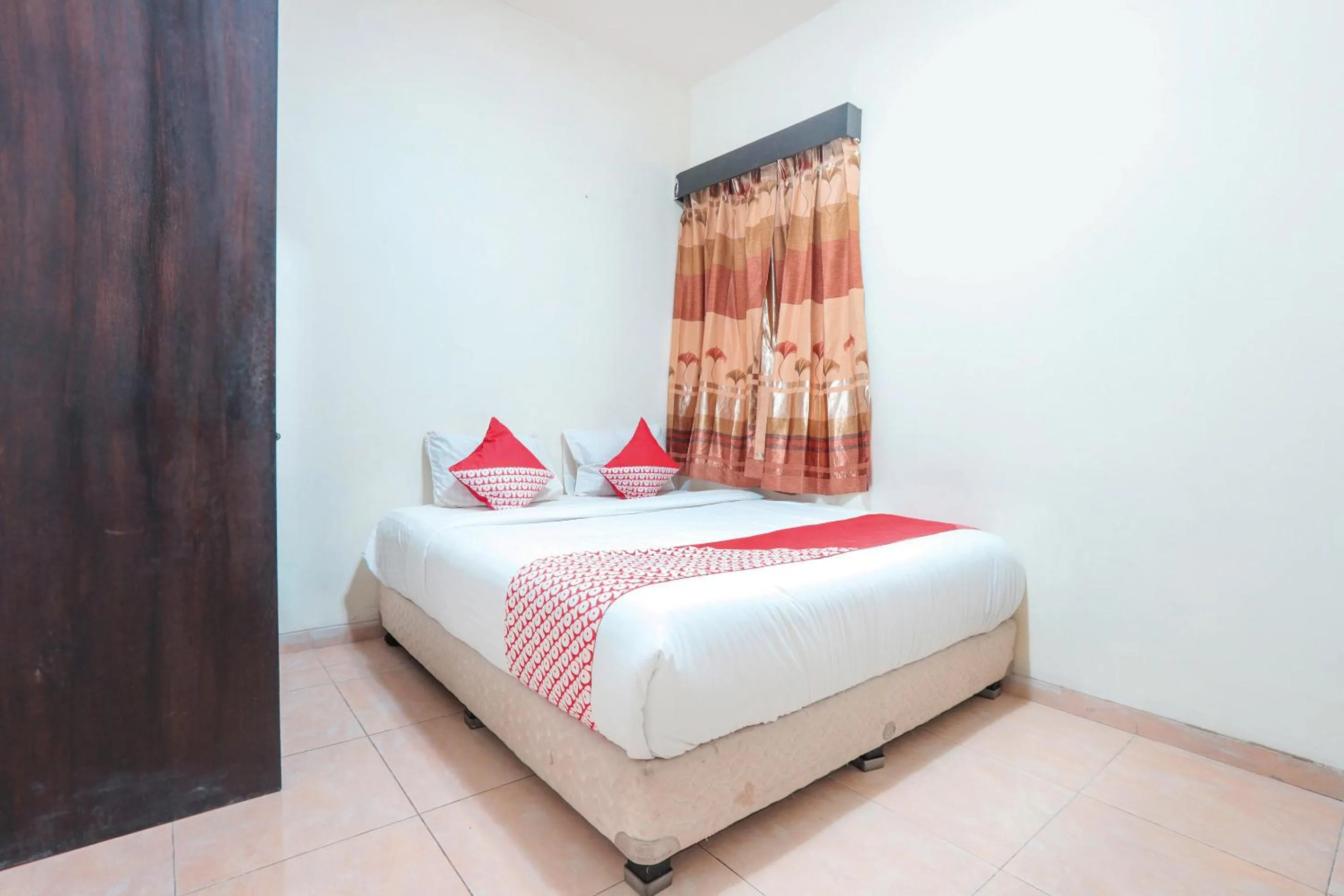 Bedroom in OYO 122 Oekude Kost