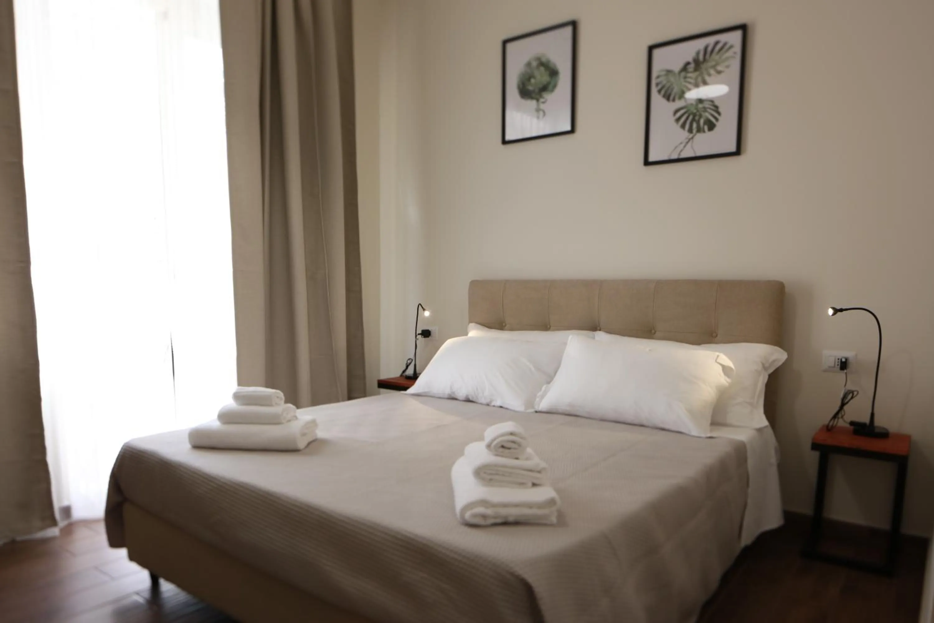 Bed in Khome Rooms & Apartment