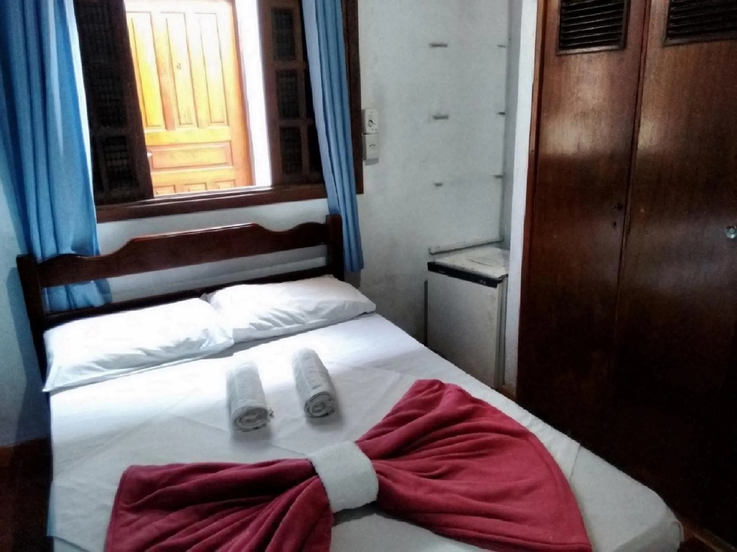 Bed in Pousada Edson