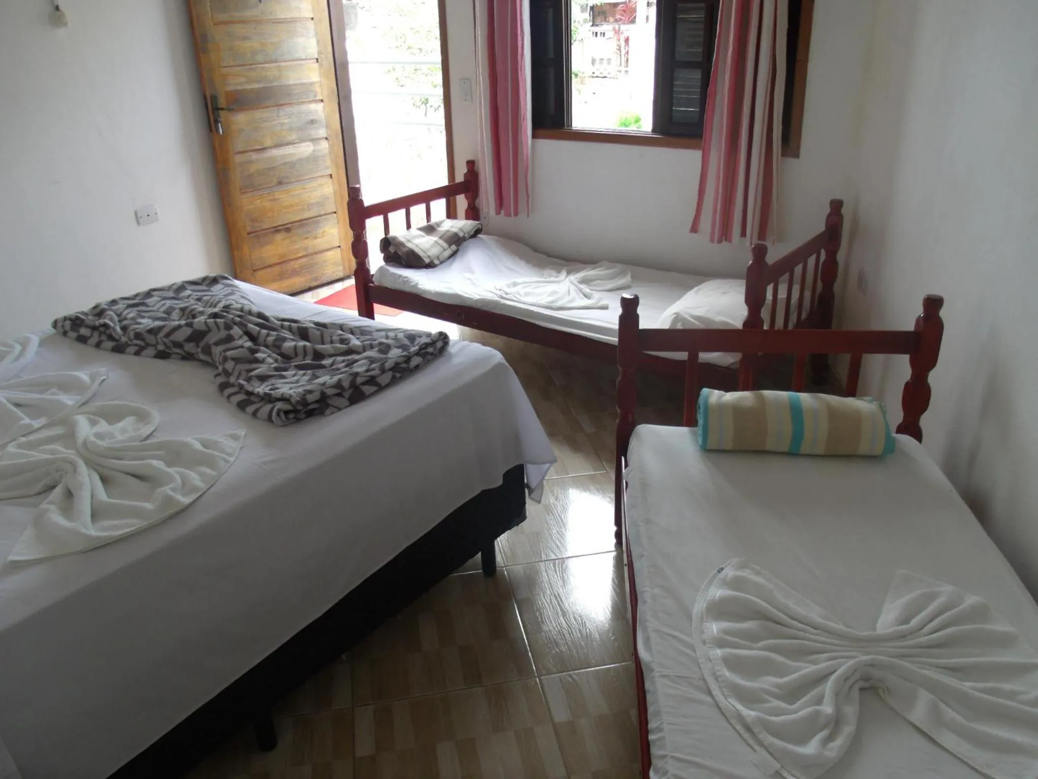 Bed in Pousada Edson