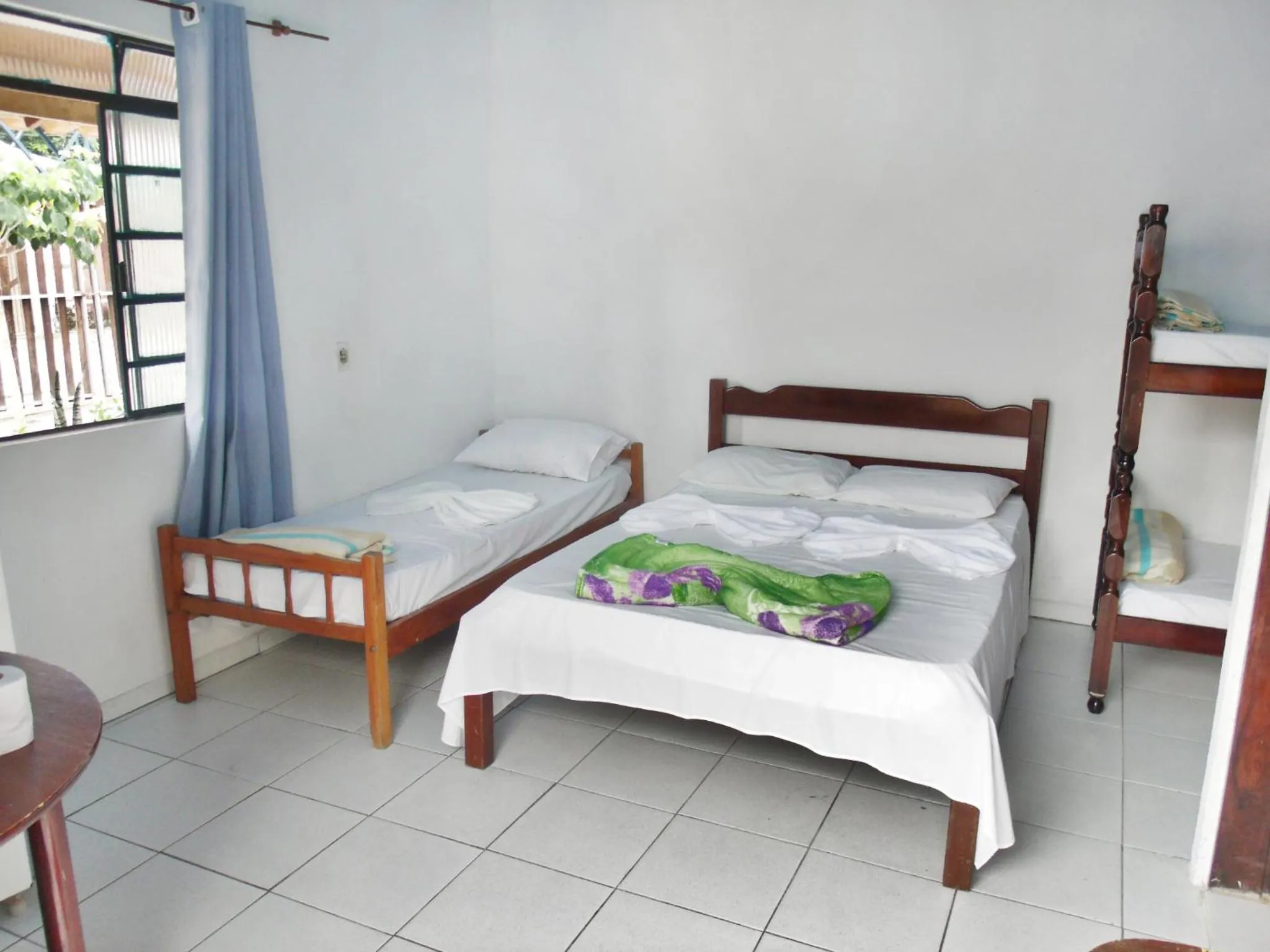 Bed in Pousada Edson