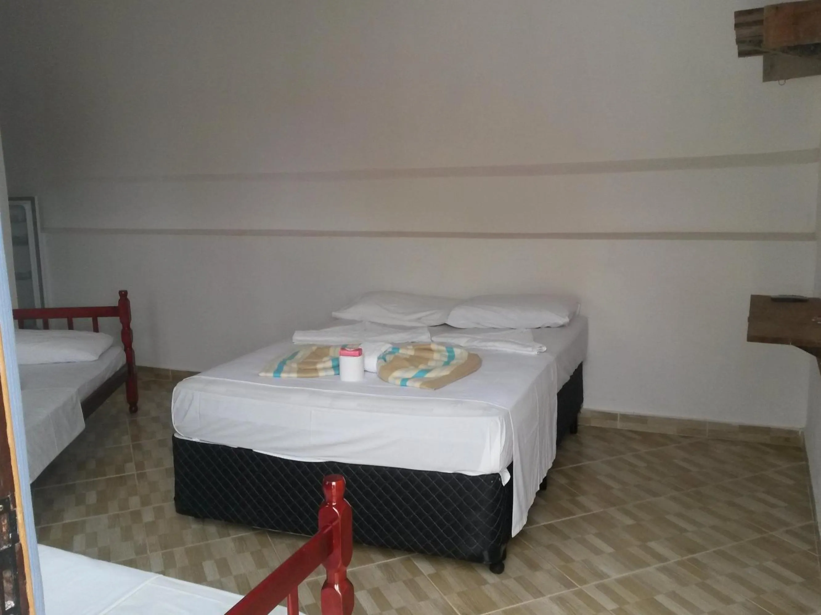 Bed in Pousada Edson