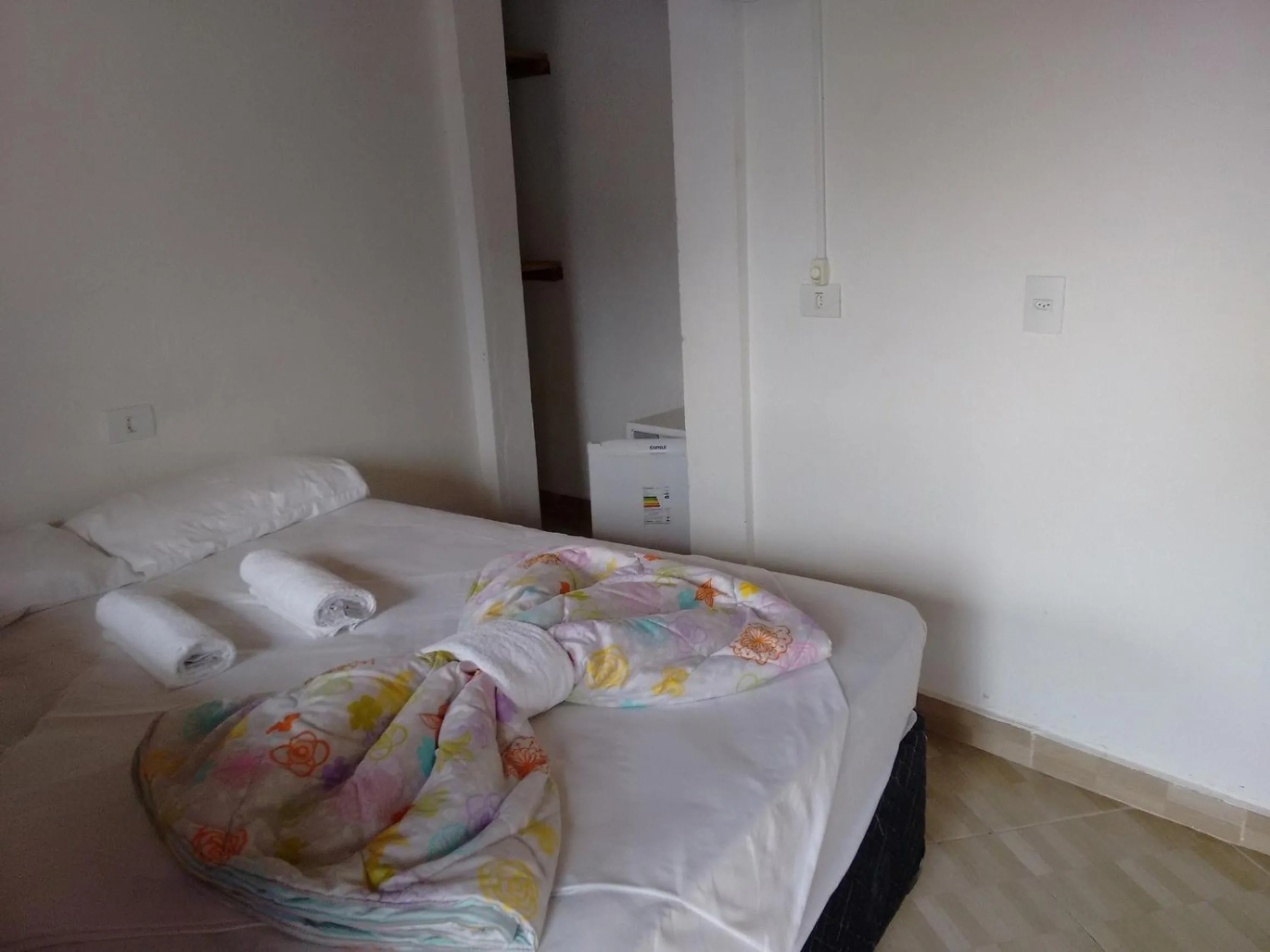 Bed in Pousada Edson