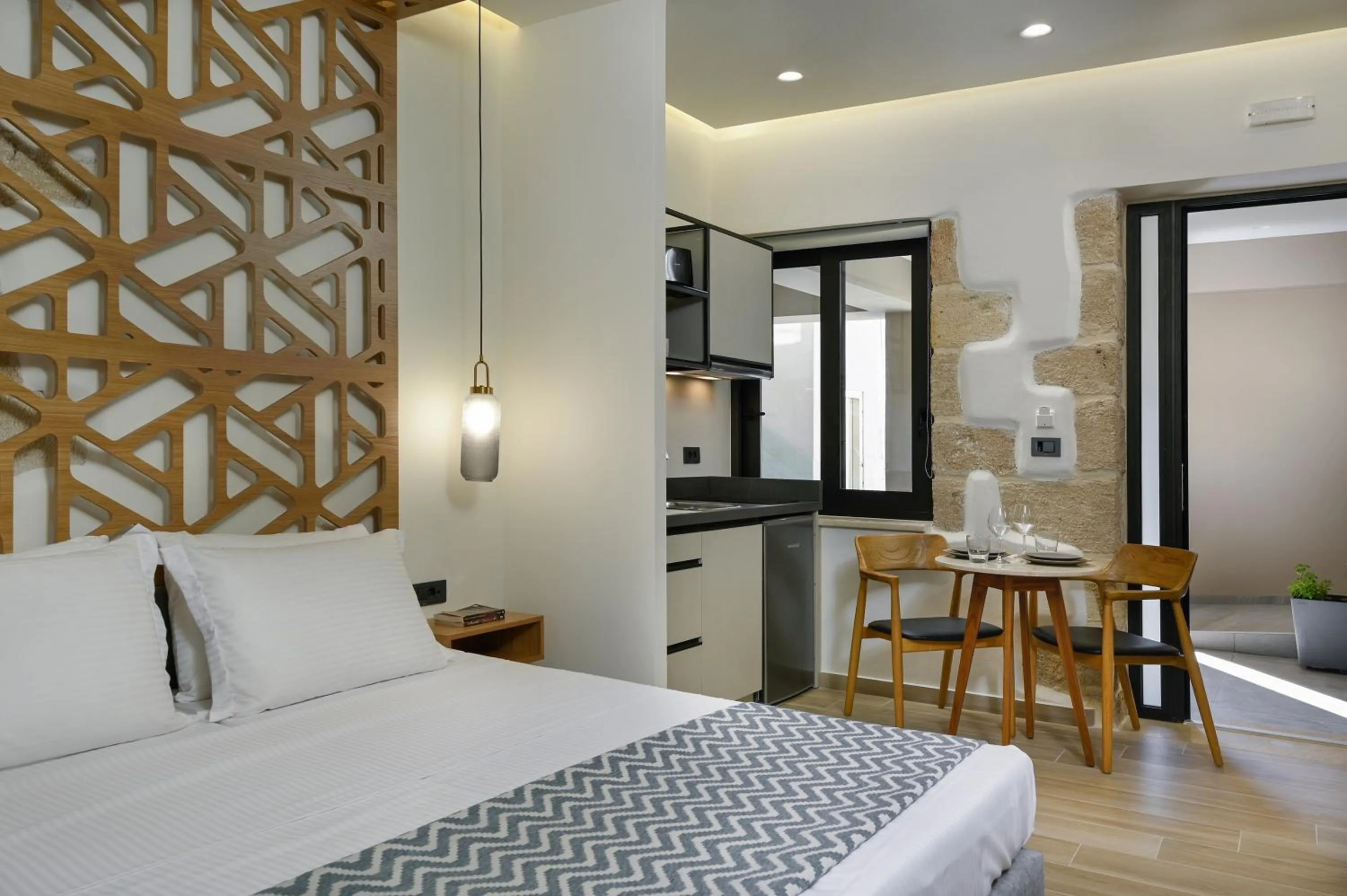 Kitchen or kitchenette, Bed in Casa D'Irene Deluxe Hotel