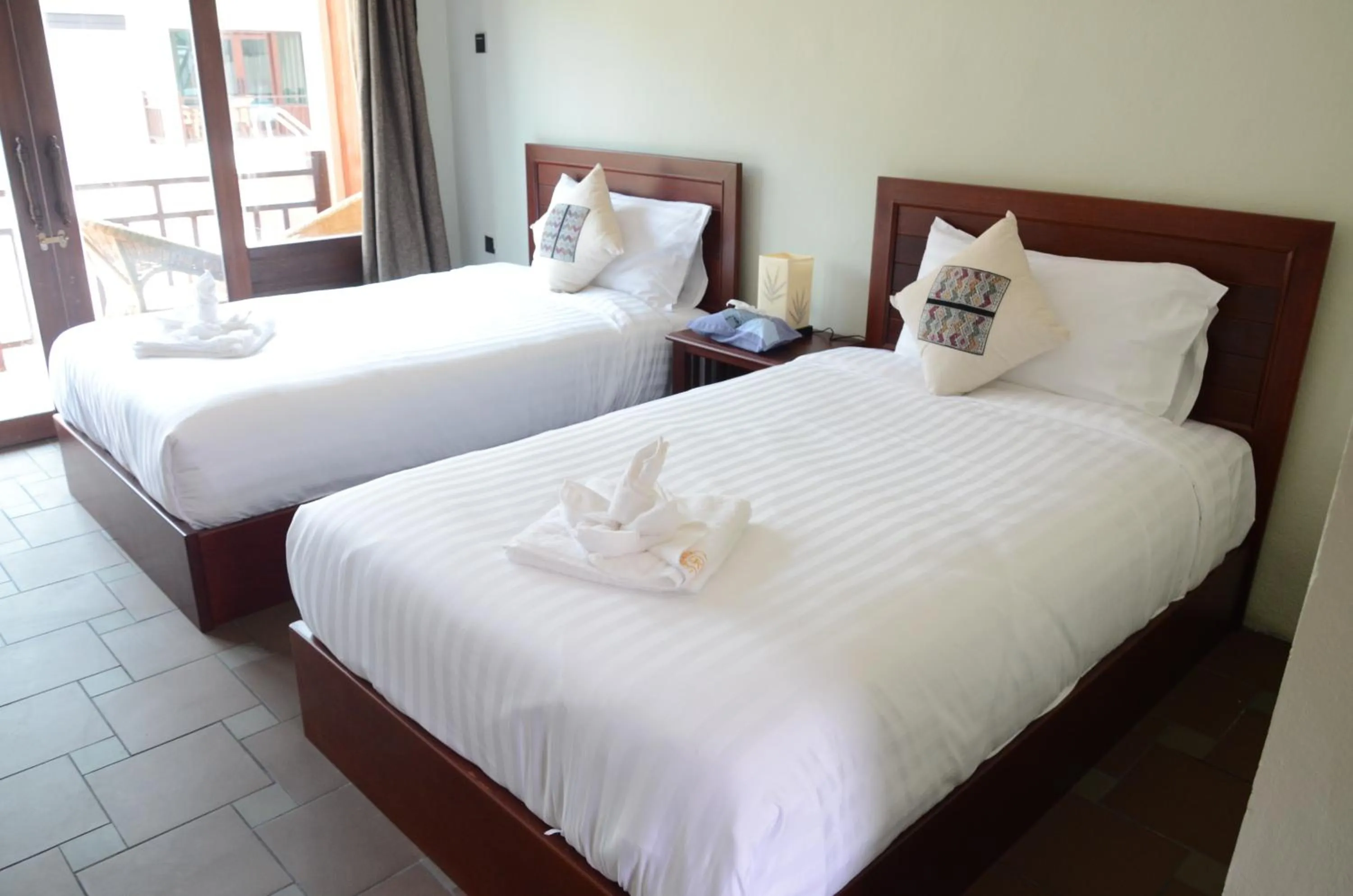 Bed in Saksiri Riverside Boutique Hotel