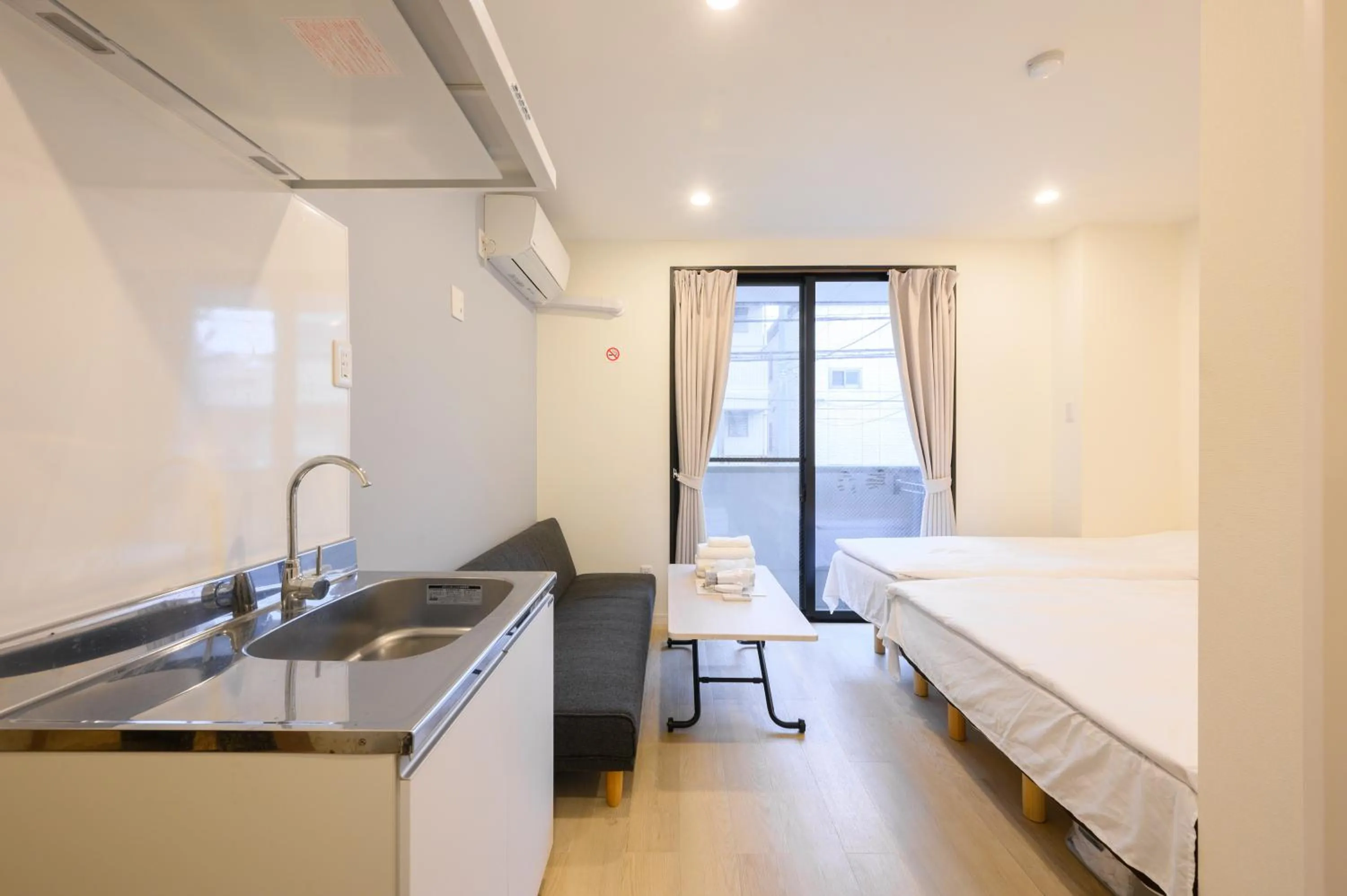 Bed in Oku Apartment