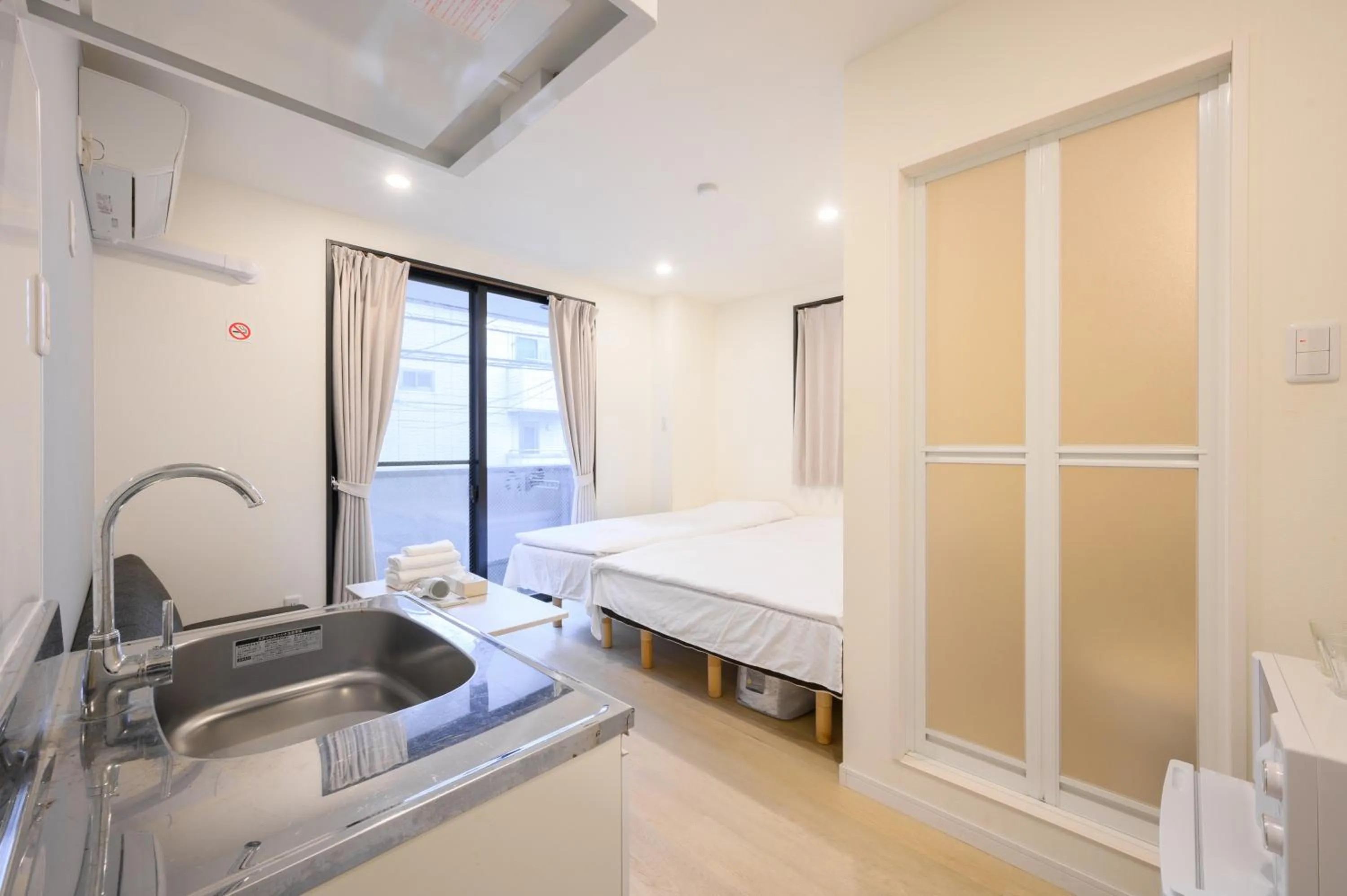 Bed in Oku Apartment