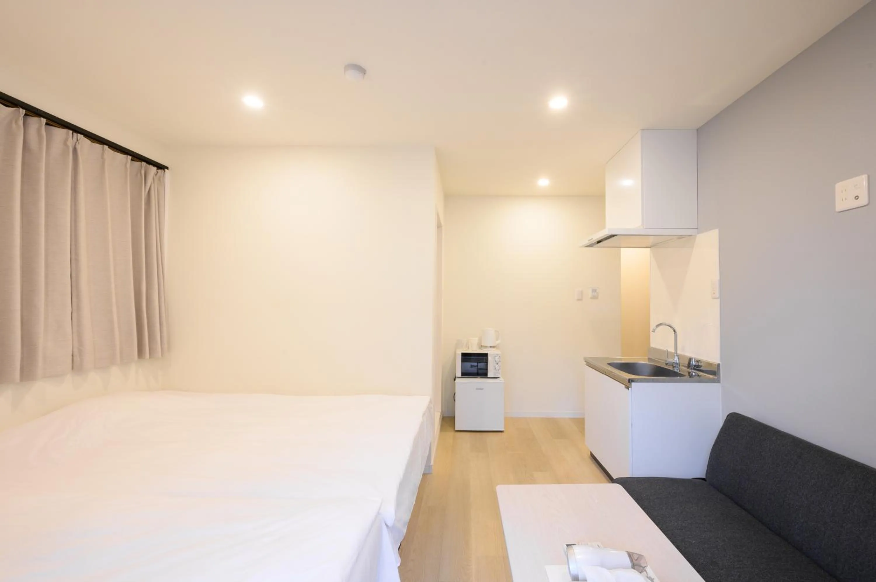 Bed in Oku Apartment