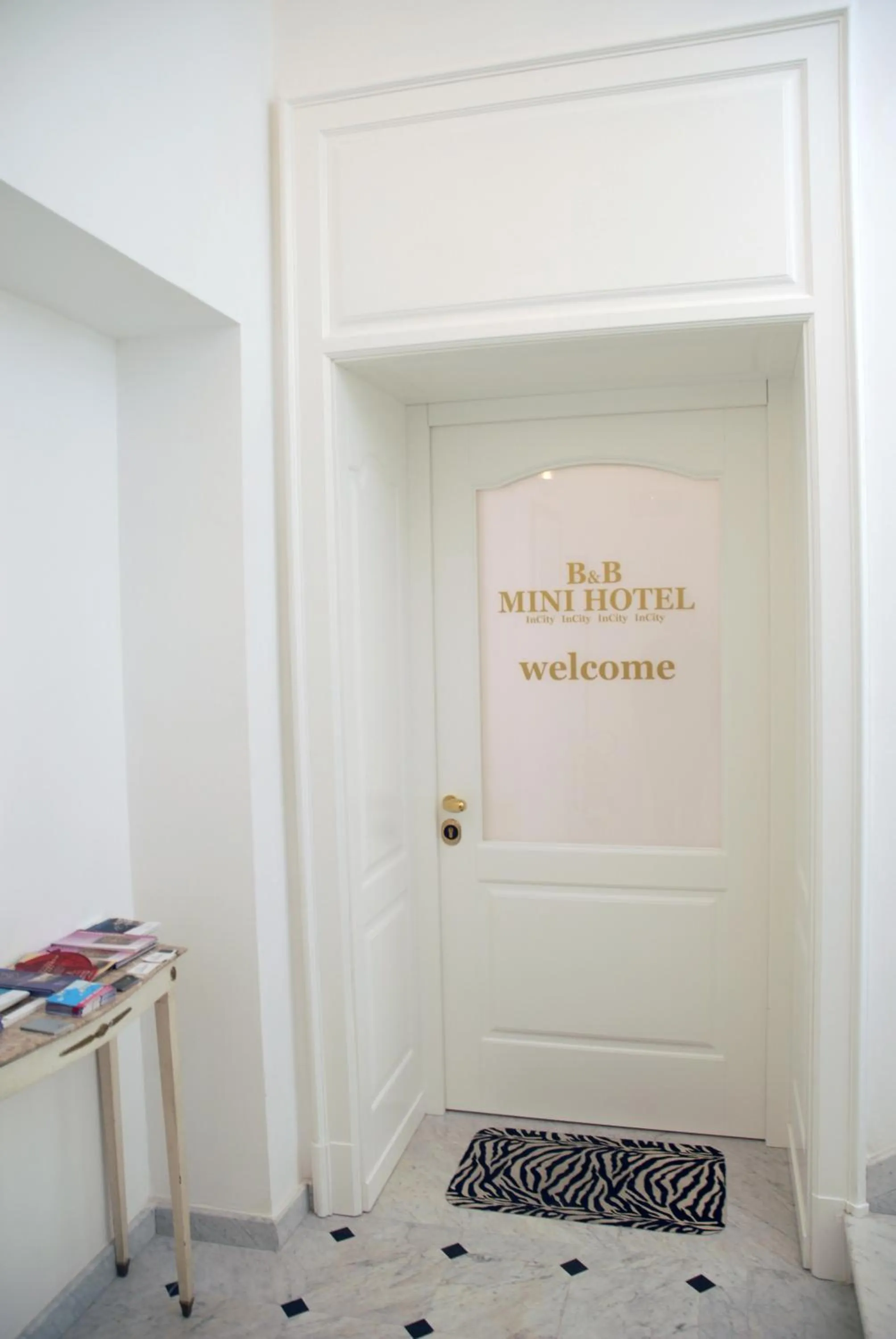 Property logo or sign in B&B Mini Hotel Incity-close train station and port-