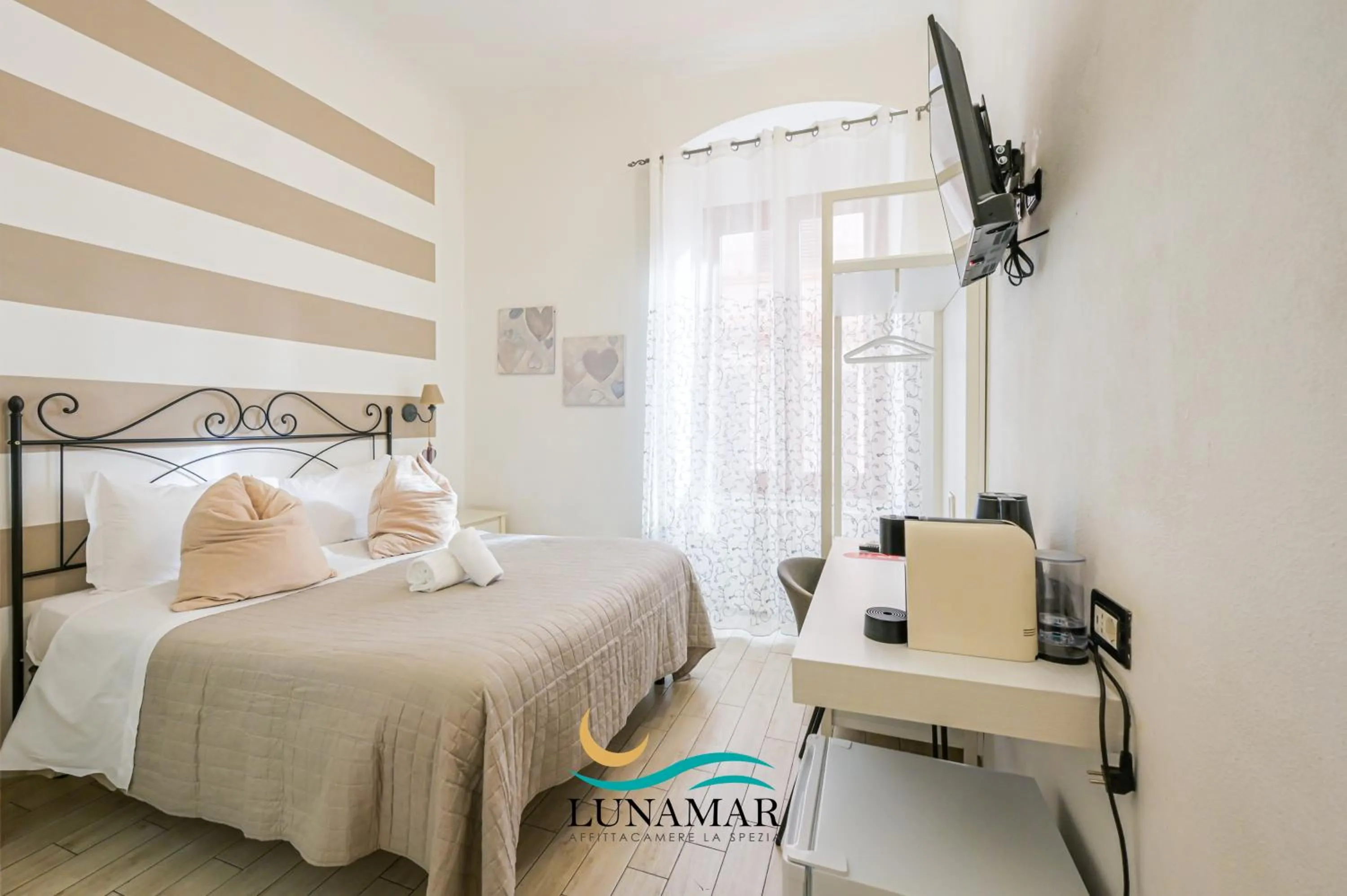 Bed in Affittacamere Lunamar