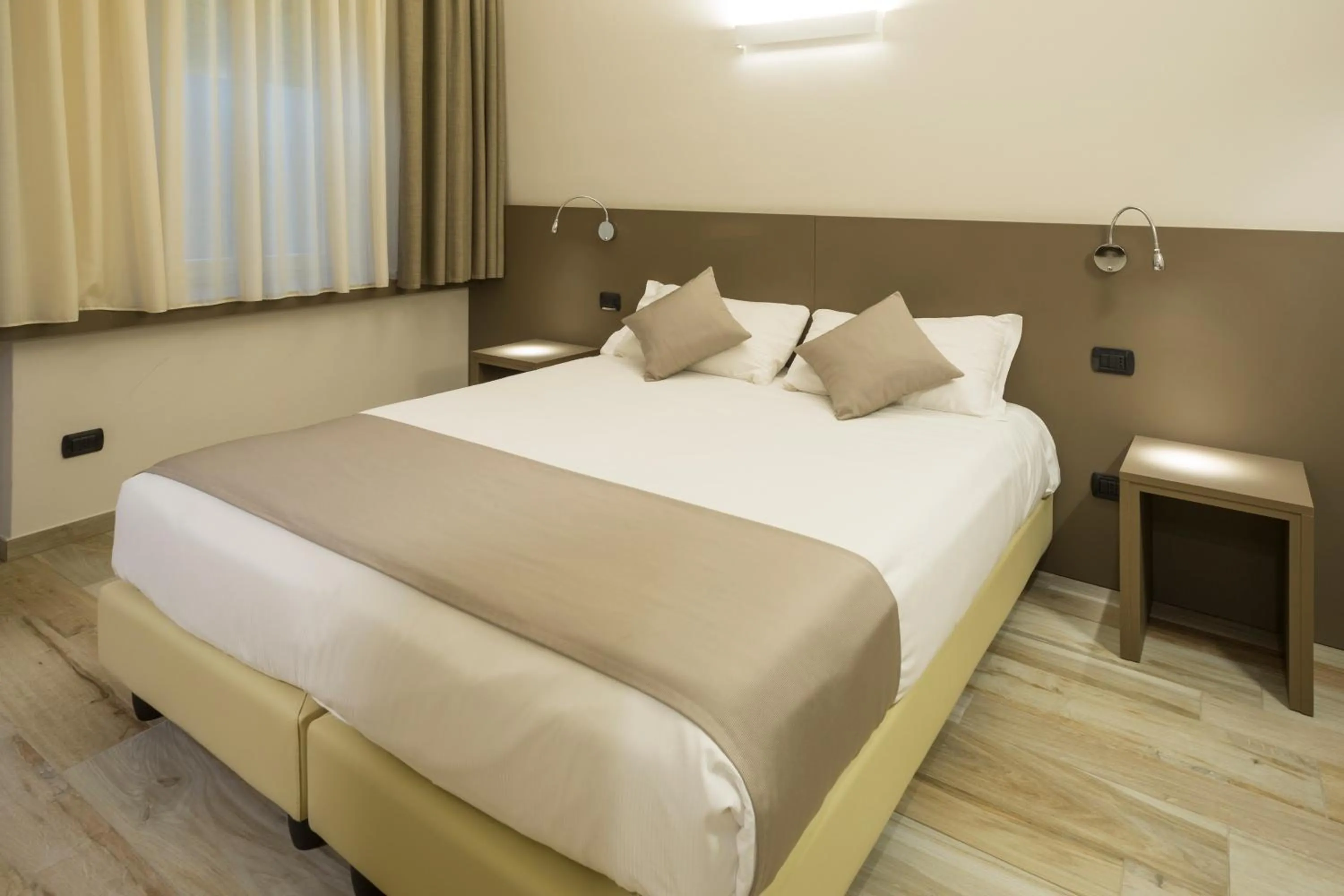 Bed in Hotel Baia di Paré