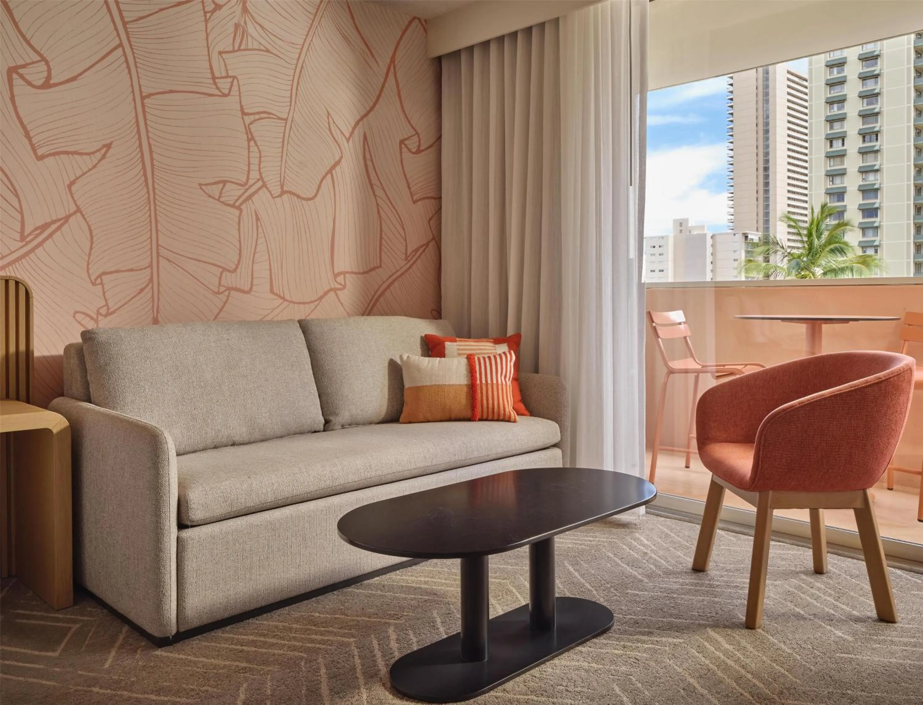 Living room in The Ambassador of Waikiki, Tapestry Collection by Hilton