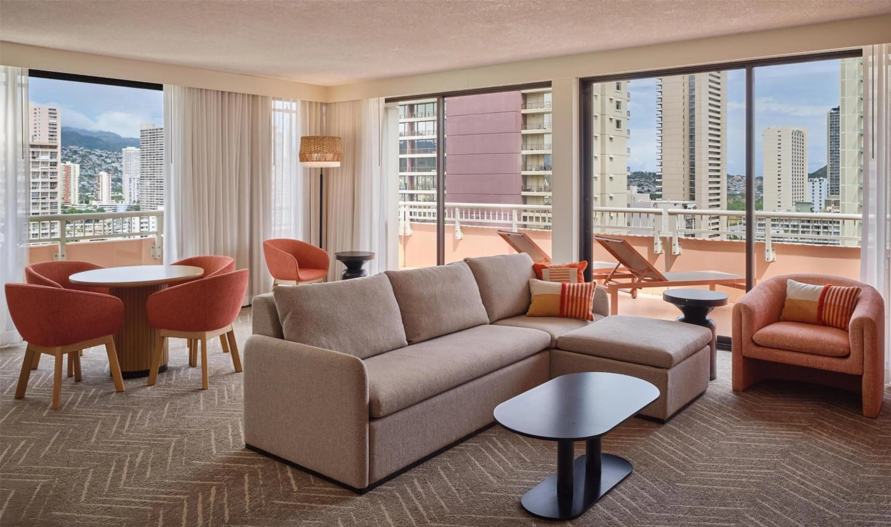 Living room in The Ambassador of Waikiki, Tapestry Collection by Hilton