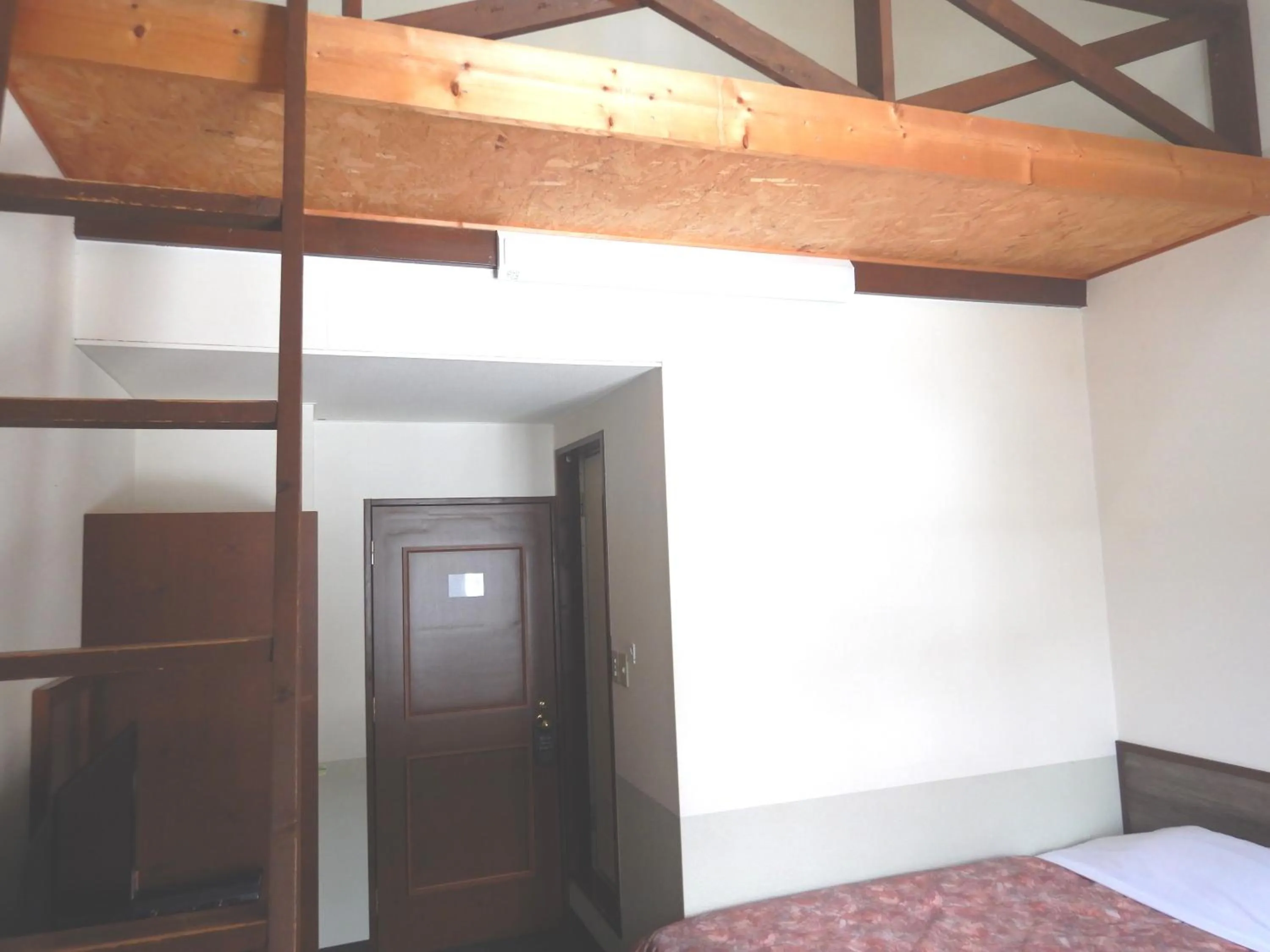 Bed in Petit Hotel Gracey Tomamu