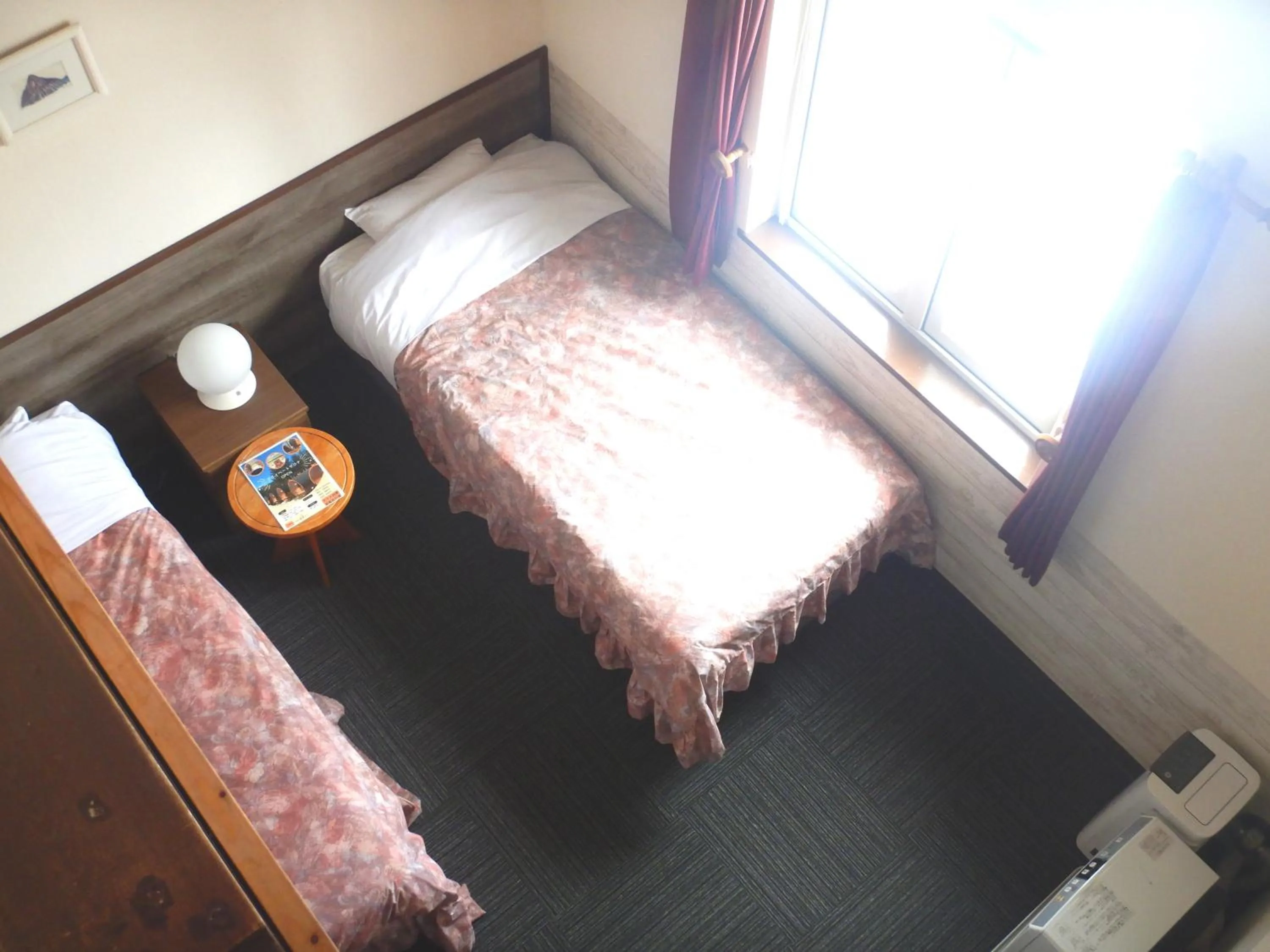 Bed in Petit Hotel Gracey Tomamu