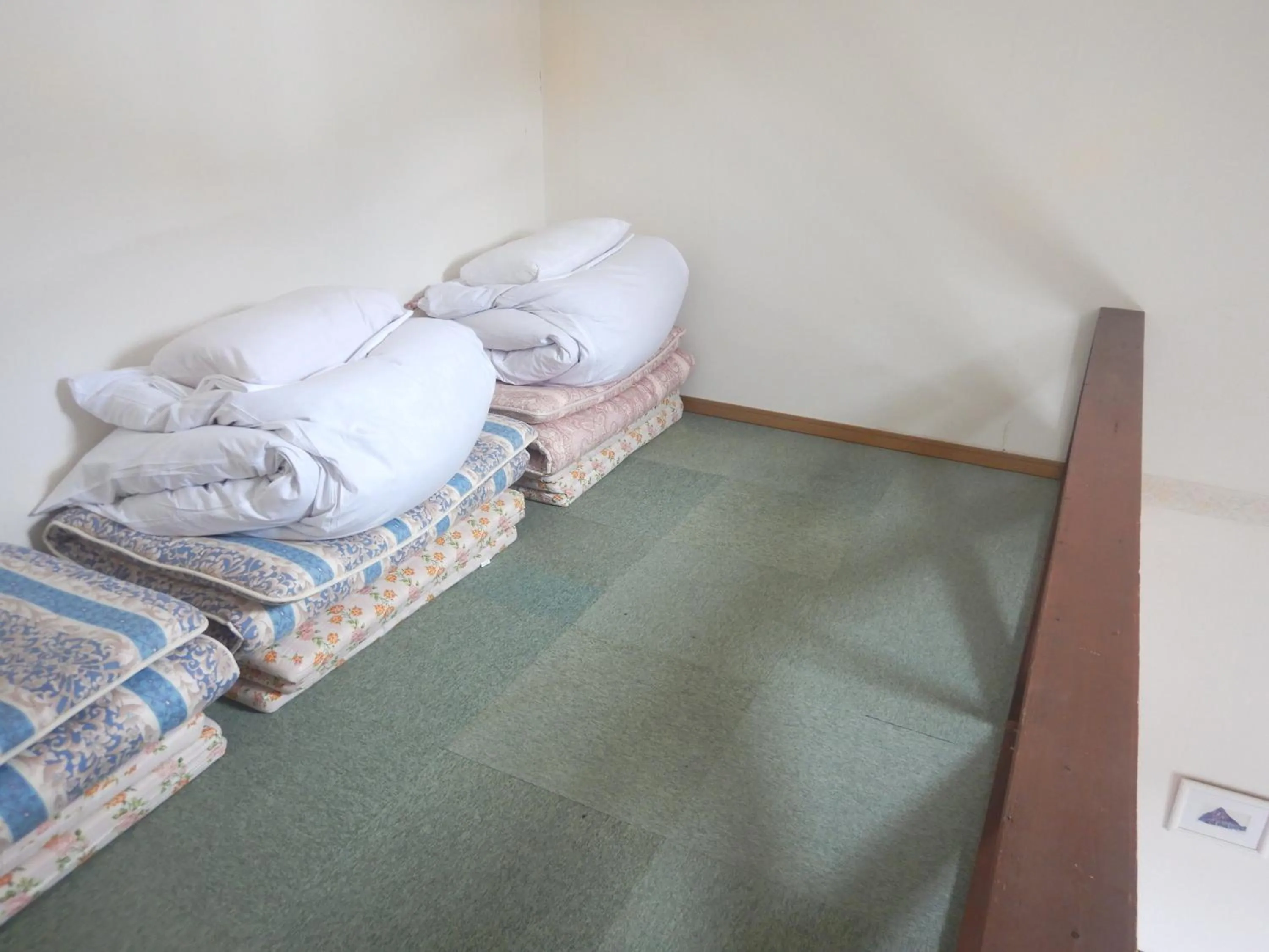 Bed in Petit Hotel Gracey Tomamu