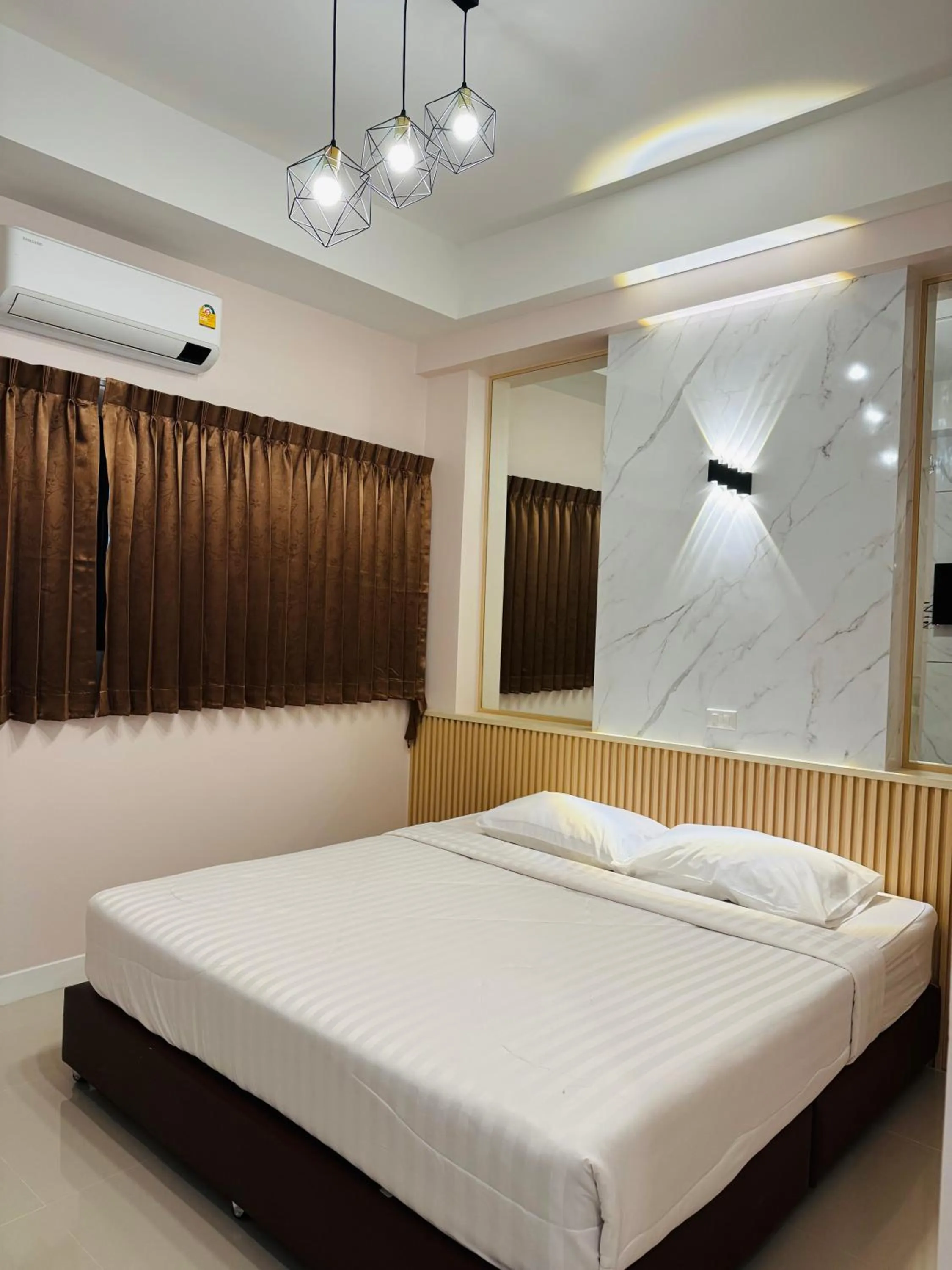 Bed in Pakchong Phubade Hotel