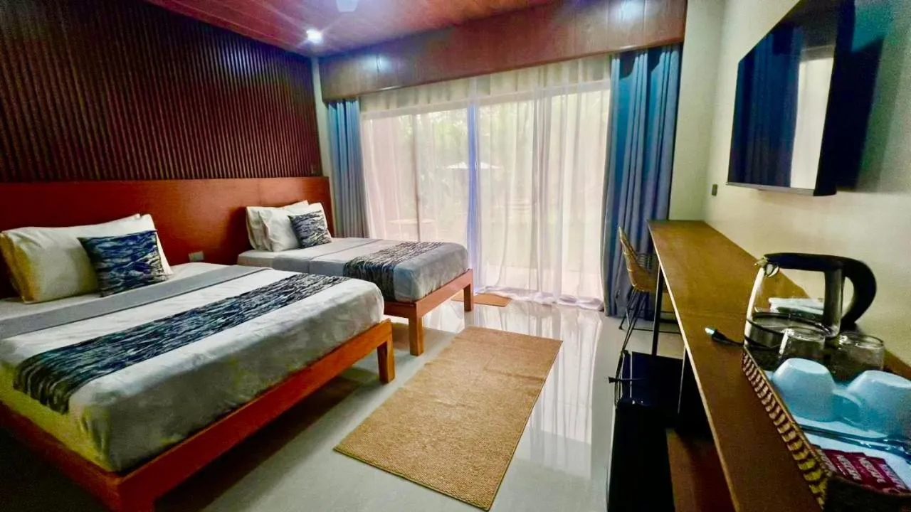 Bed in Southseas Beach Resort and Dive Center