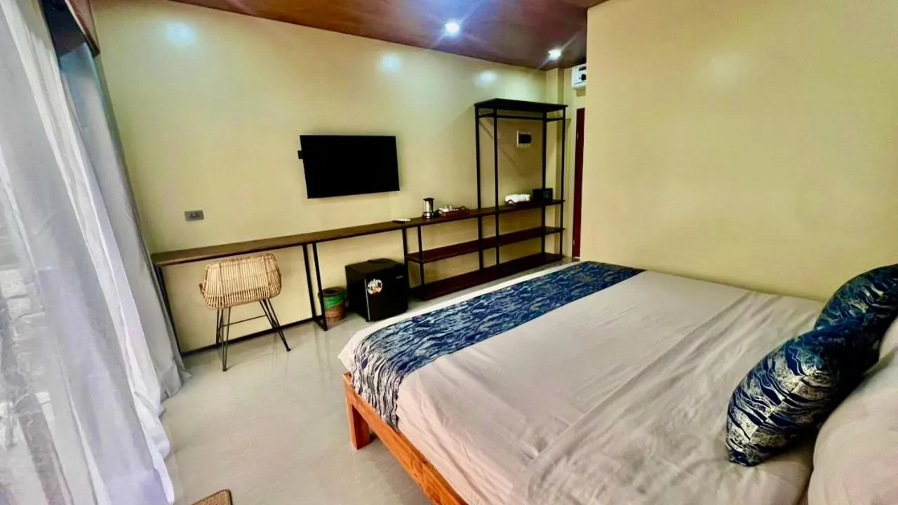 Bed in Southseas Beach Resort and Dive Center