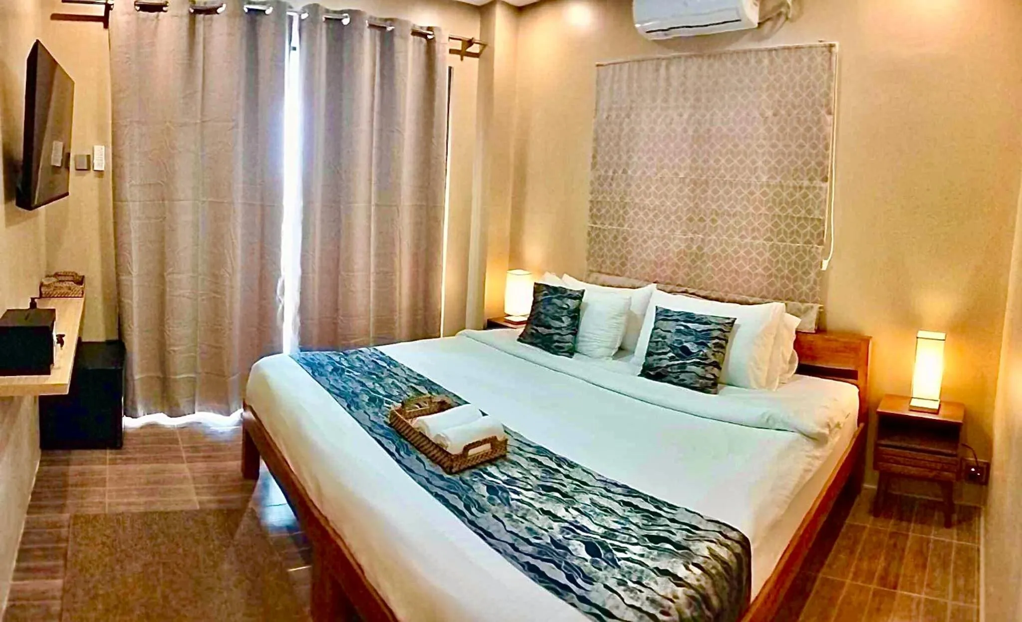 Bed in Southseas Beach Resort and Dive Center