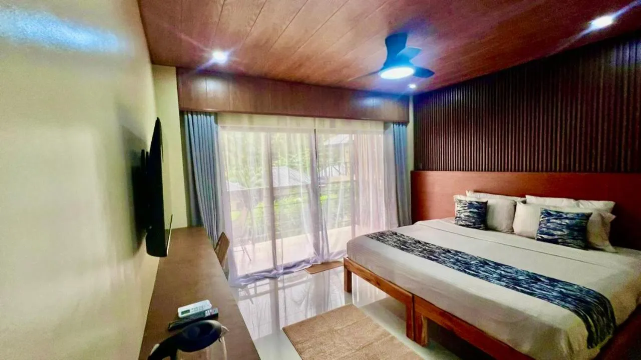 Bed in Southseas Beach Resort and Dive Center