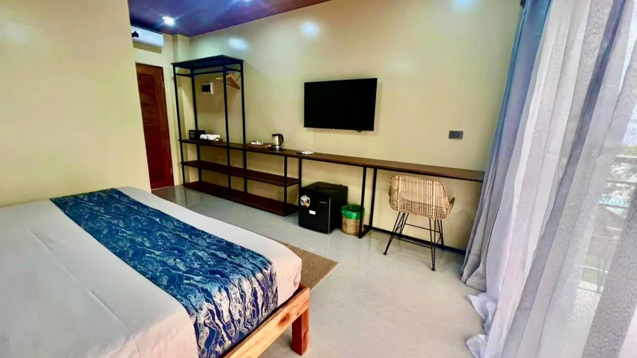 Bed in Southseas Beach Resort and Dive Center