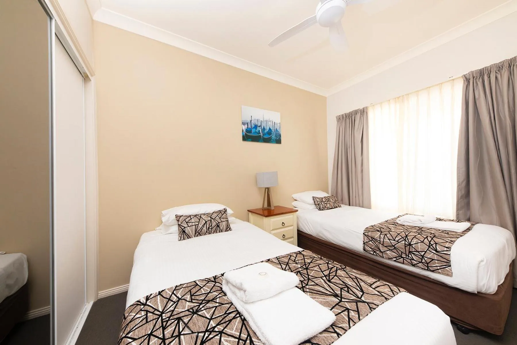 Bed in Meridian Beachside Apartments