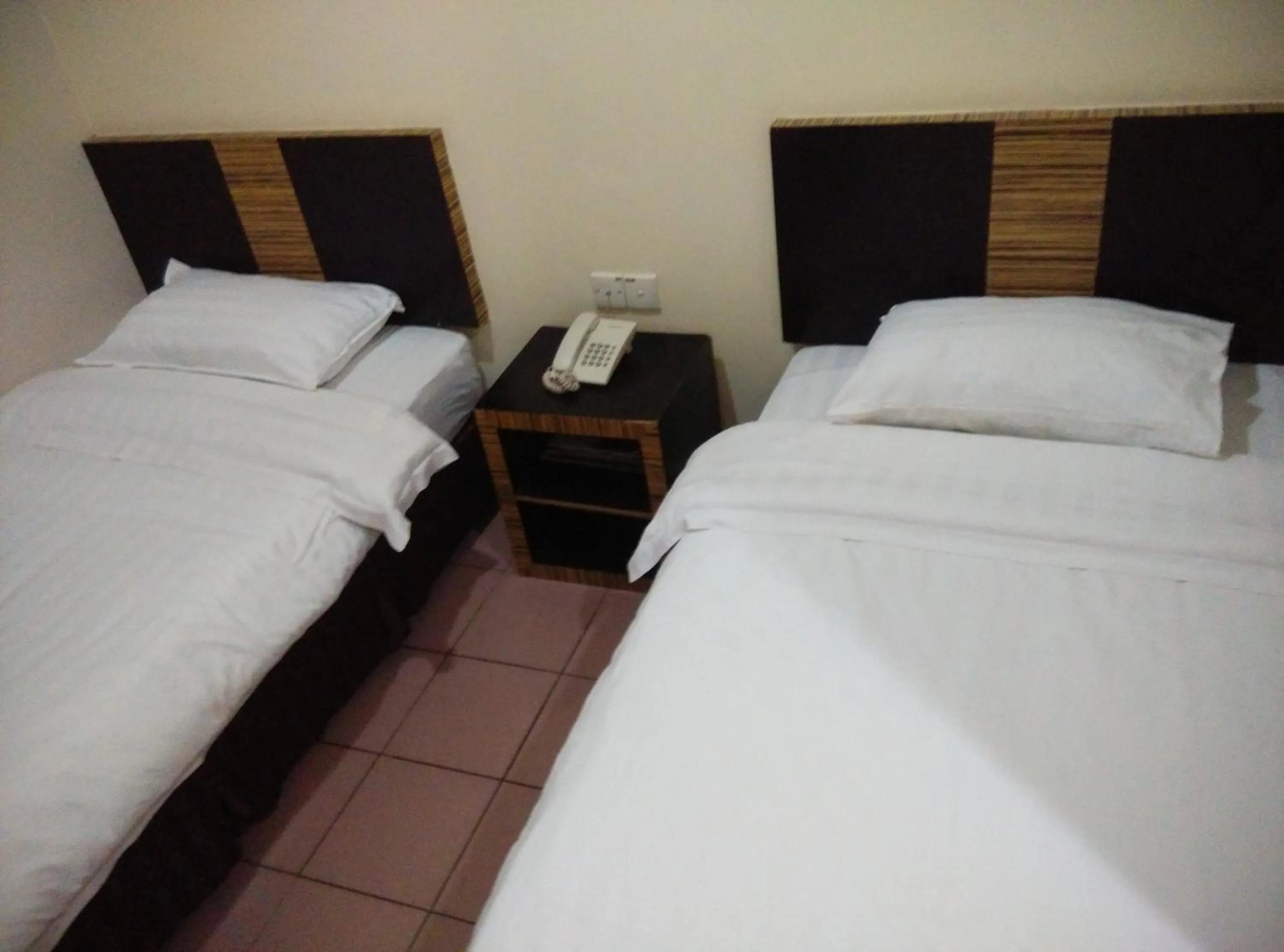 Bed in Hotel Traveller