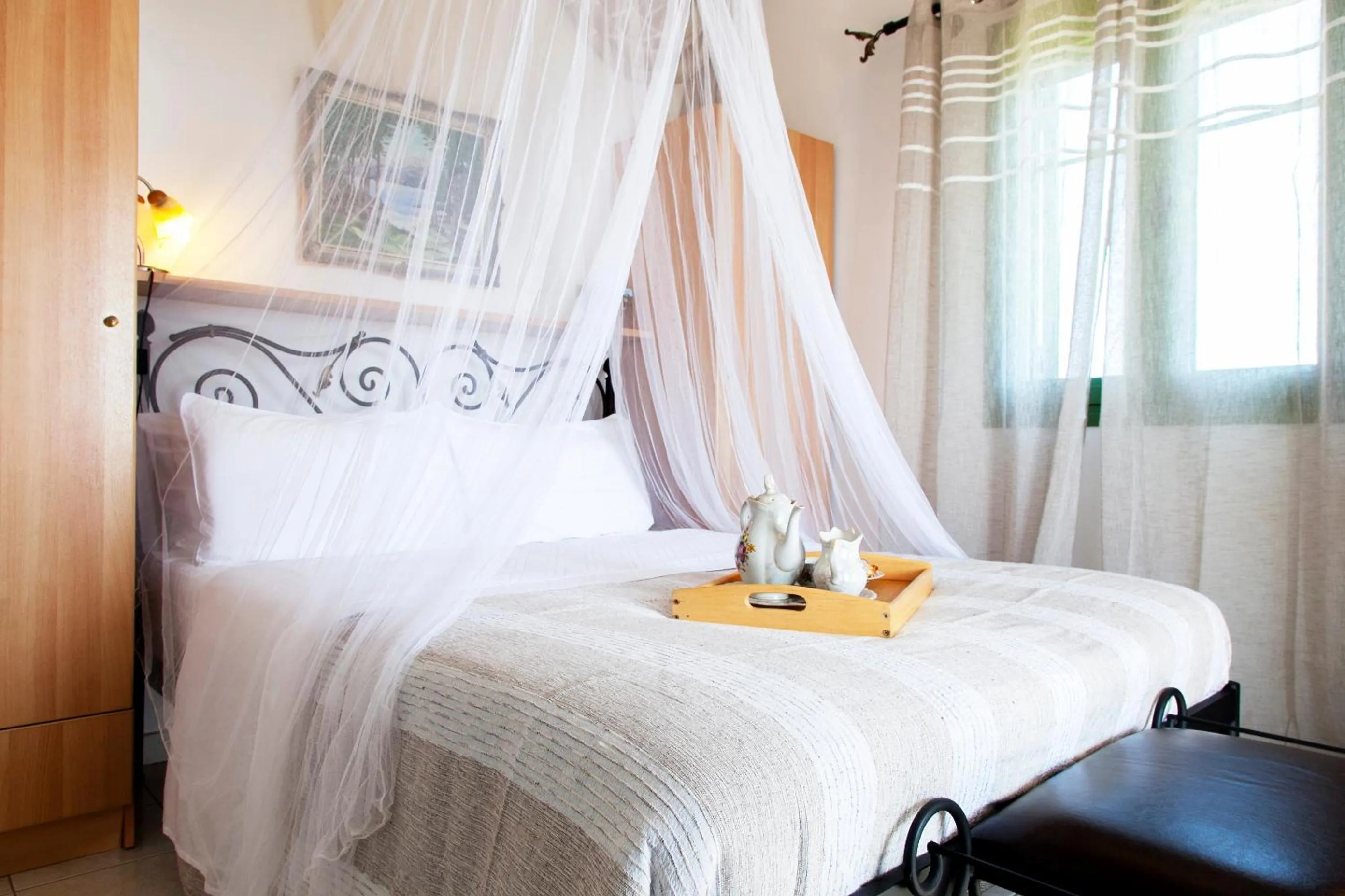 Bed in Monambeles Villas