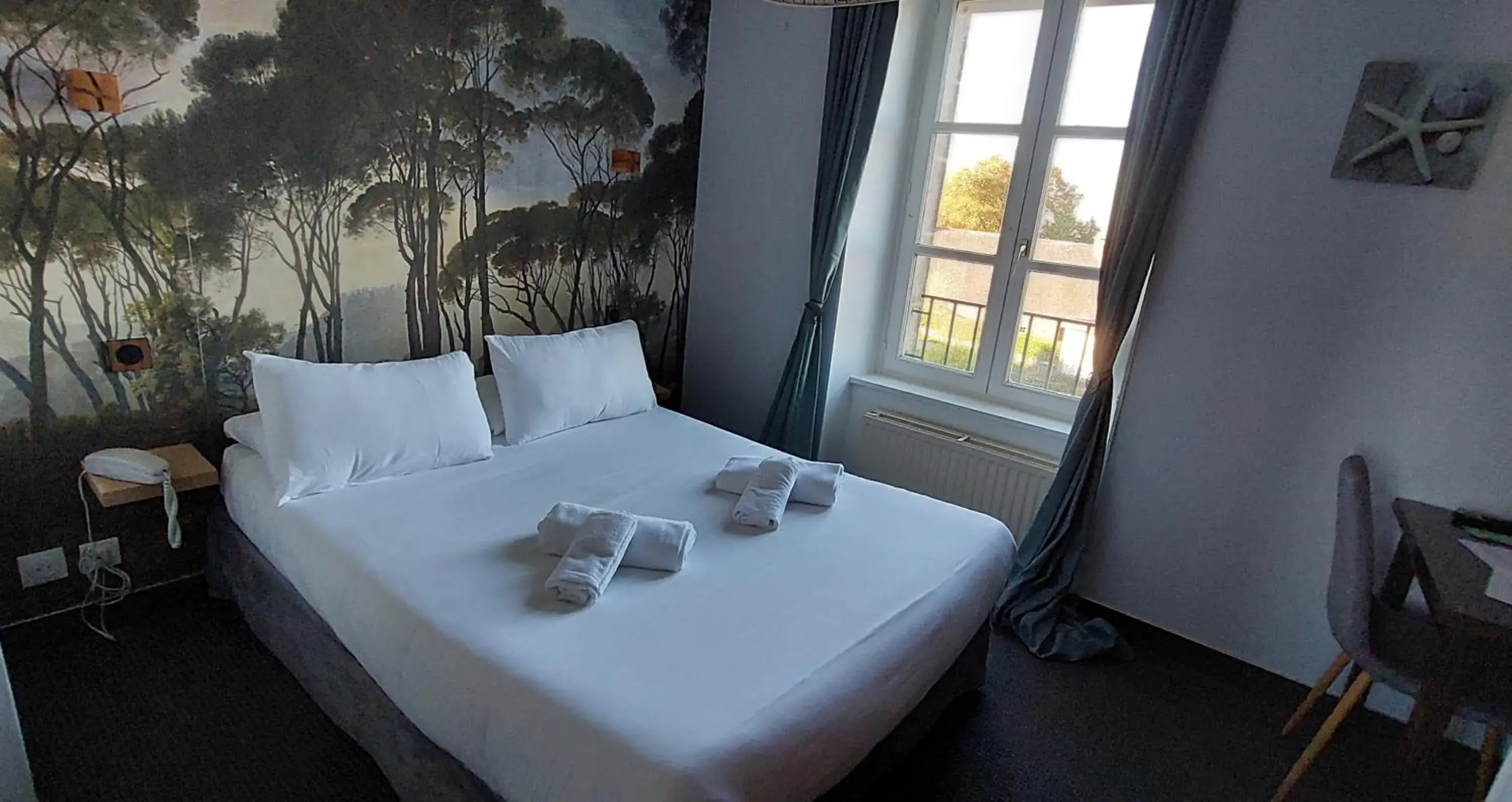 Bed in Logis Le Prieuré Bed in Logis Le Prieuré