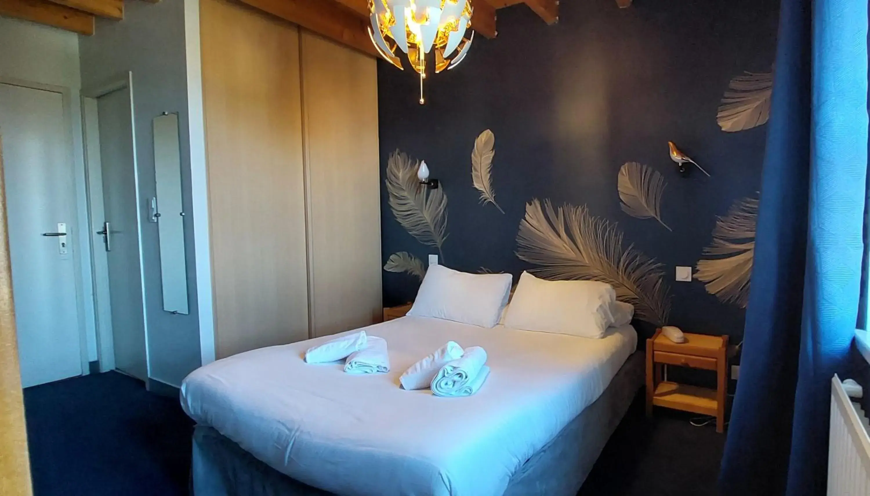 Bed in Logis Le Prieuré Bed in Logis Le Prieuré