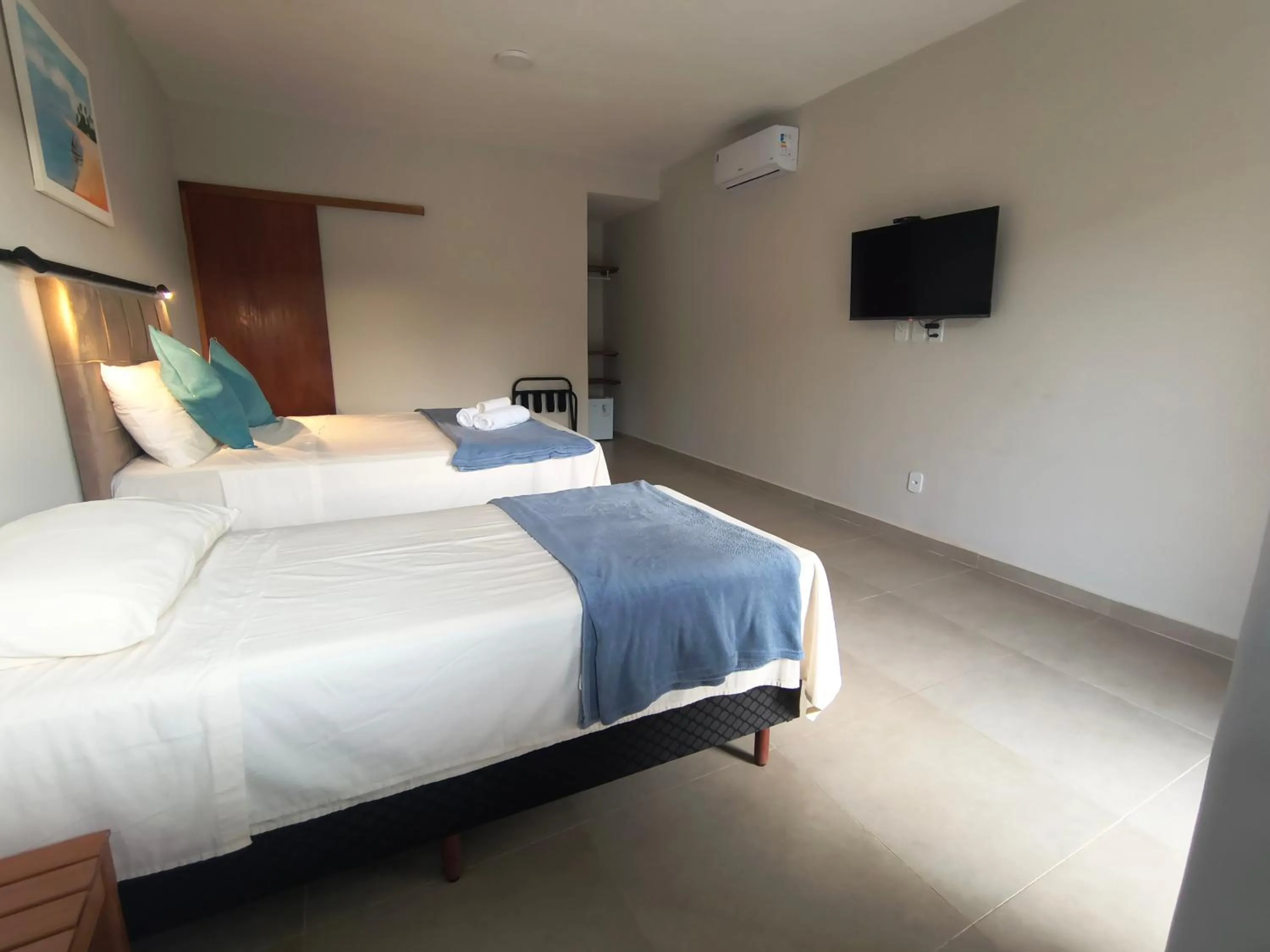 Bed in Pousada New Paradise