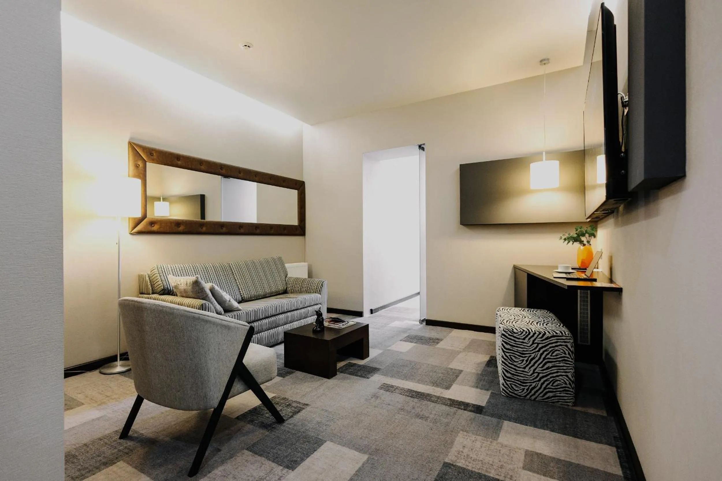 Living room in City Park Stay by CHM