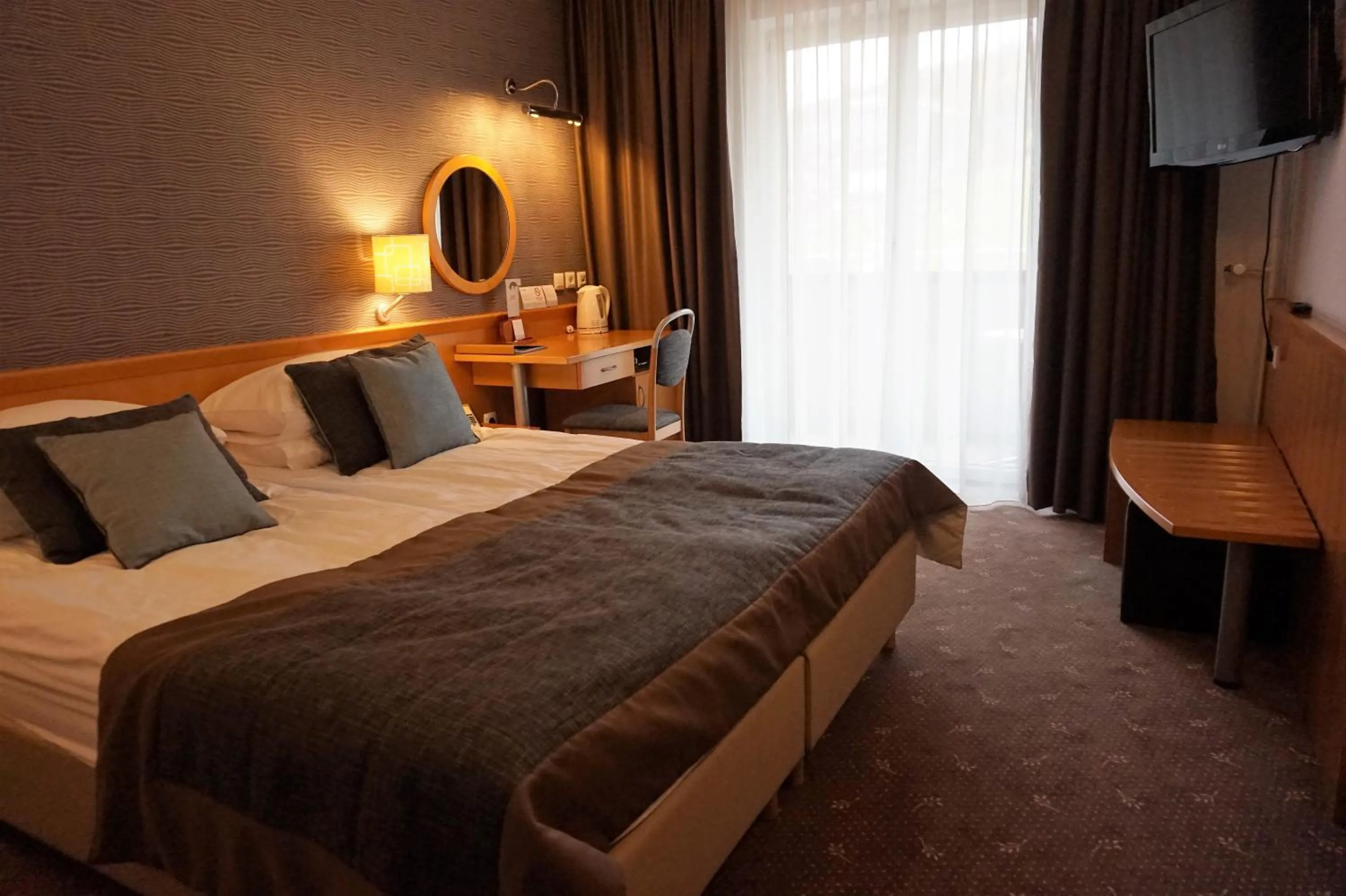 Photo of the whole room, Bed in Ramada Resort Kranjska Gora