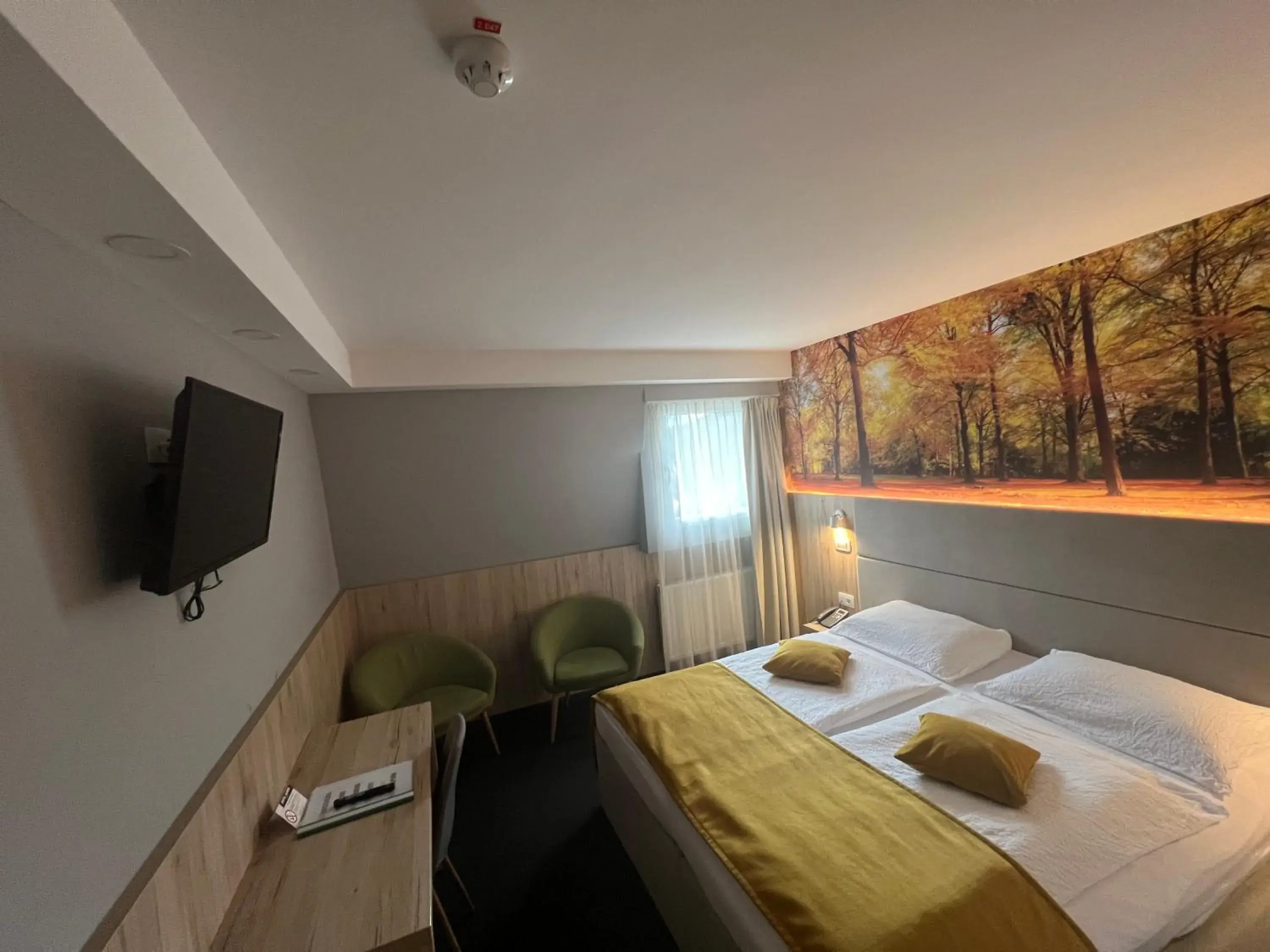 Bed in Hotel Alpina Bed in Hotel Alpina