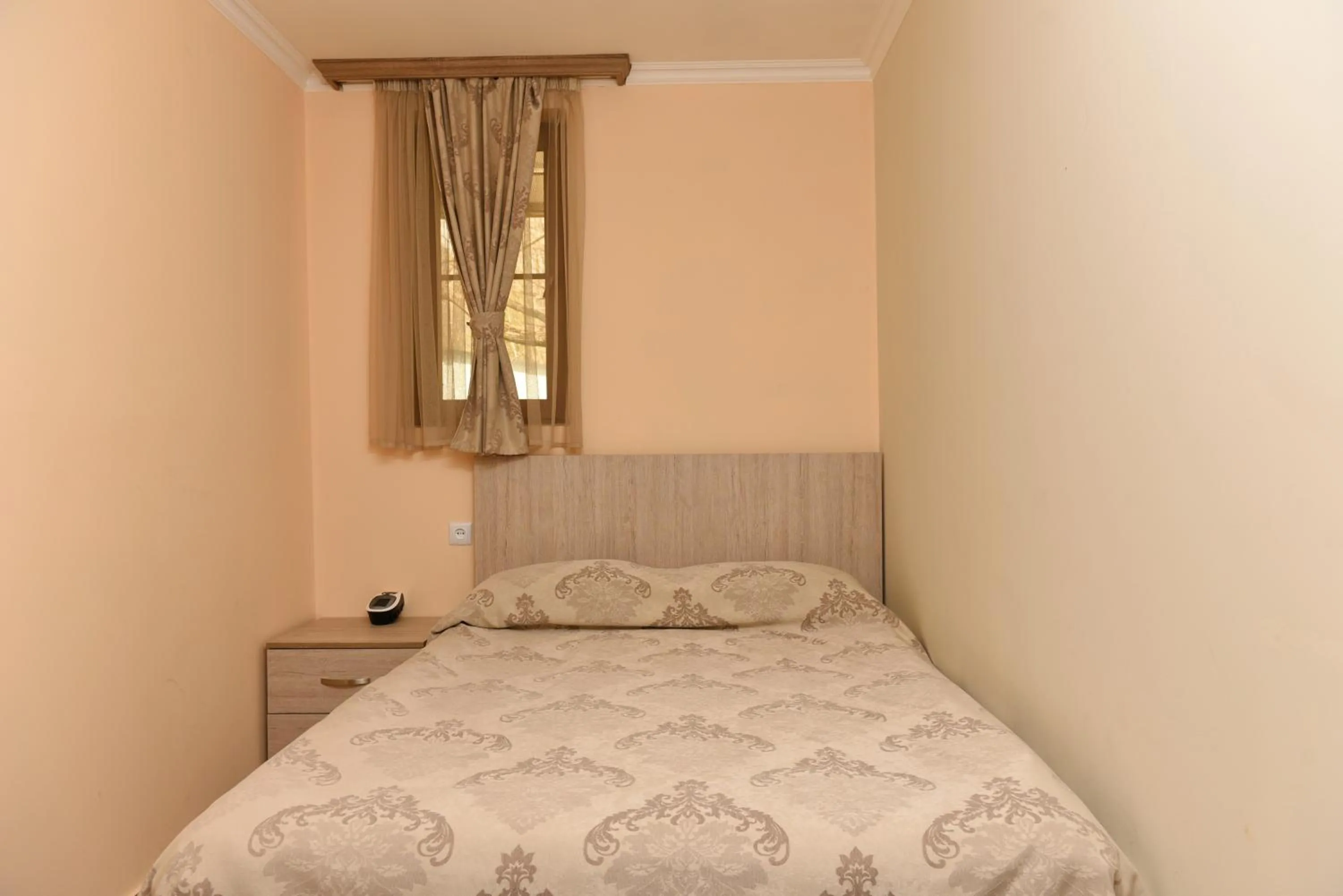 Bed in GreenWood Hotel