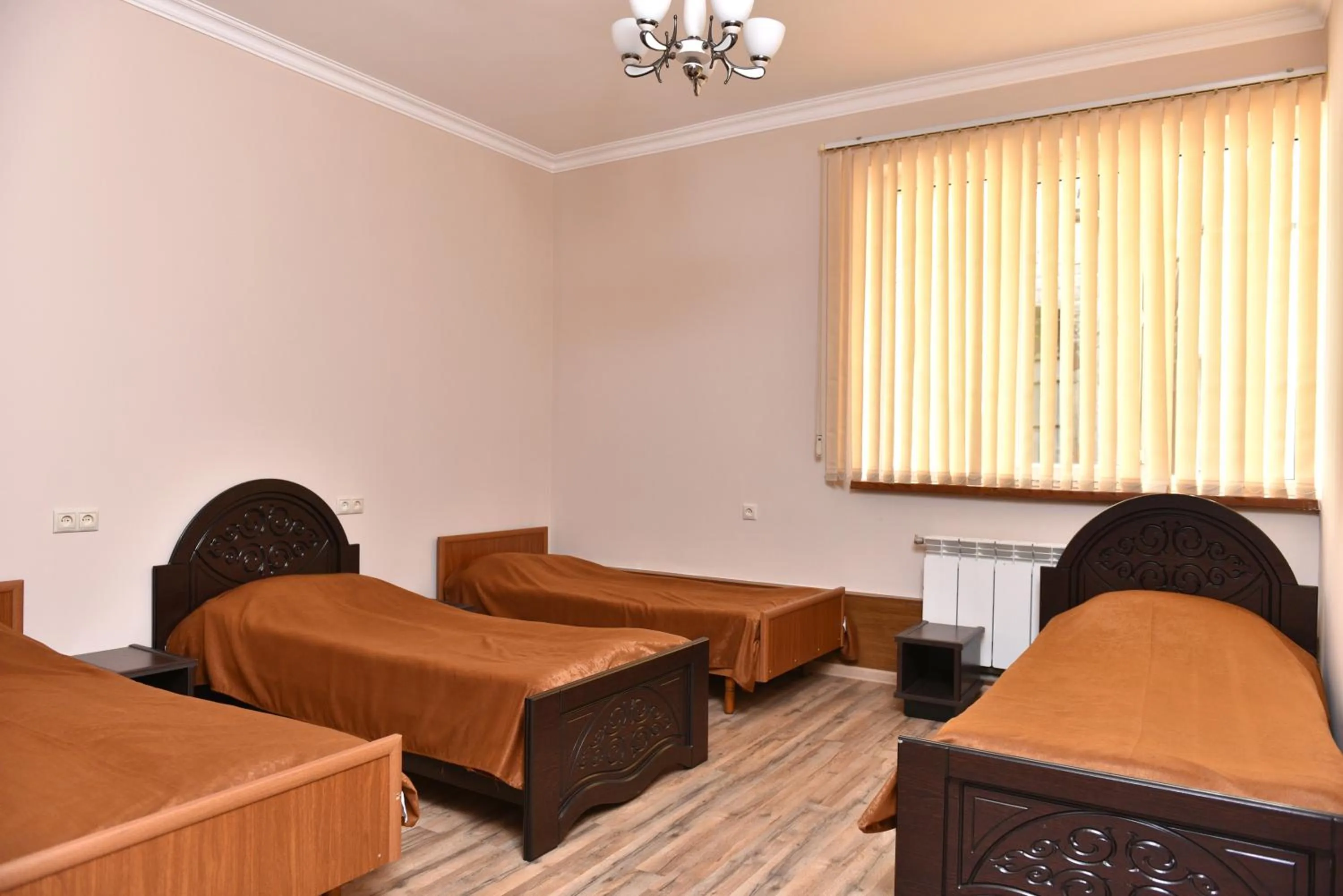 Bed in GreenWood Hotel