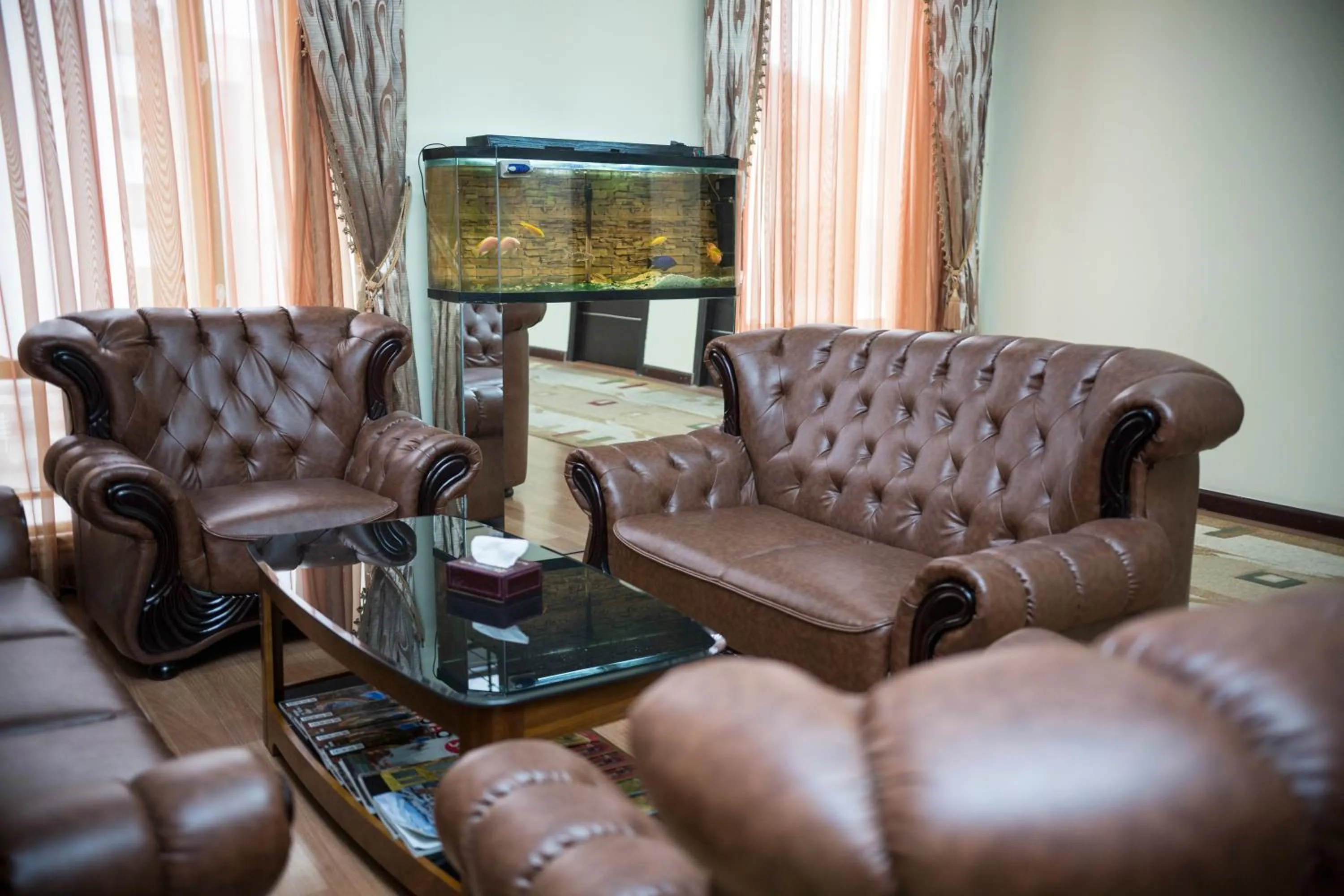Communal lounge/ TV room in Capital Hotel