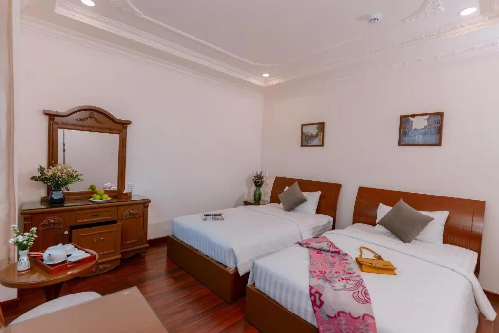 Bed in DAHLIALAND SAIGON HOTEL & SWIMMING PooL