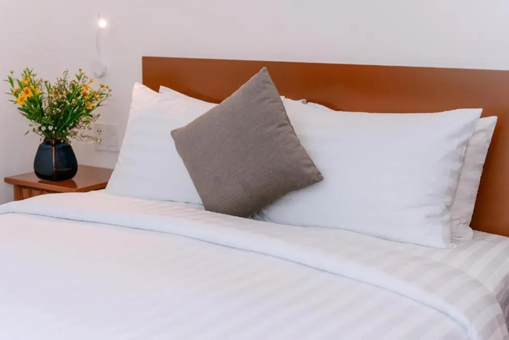 Bed in DAHLIALAND SAIGON HOTEL & SWIMMING PooL