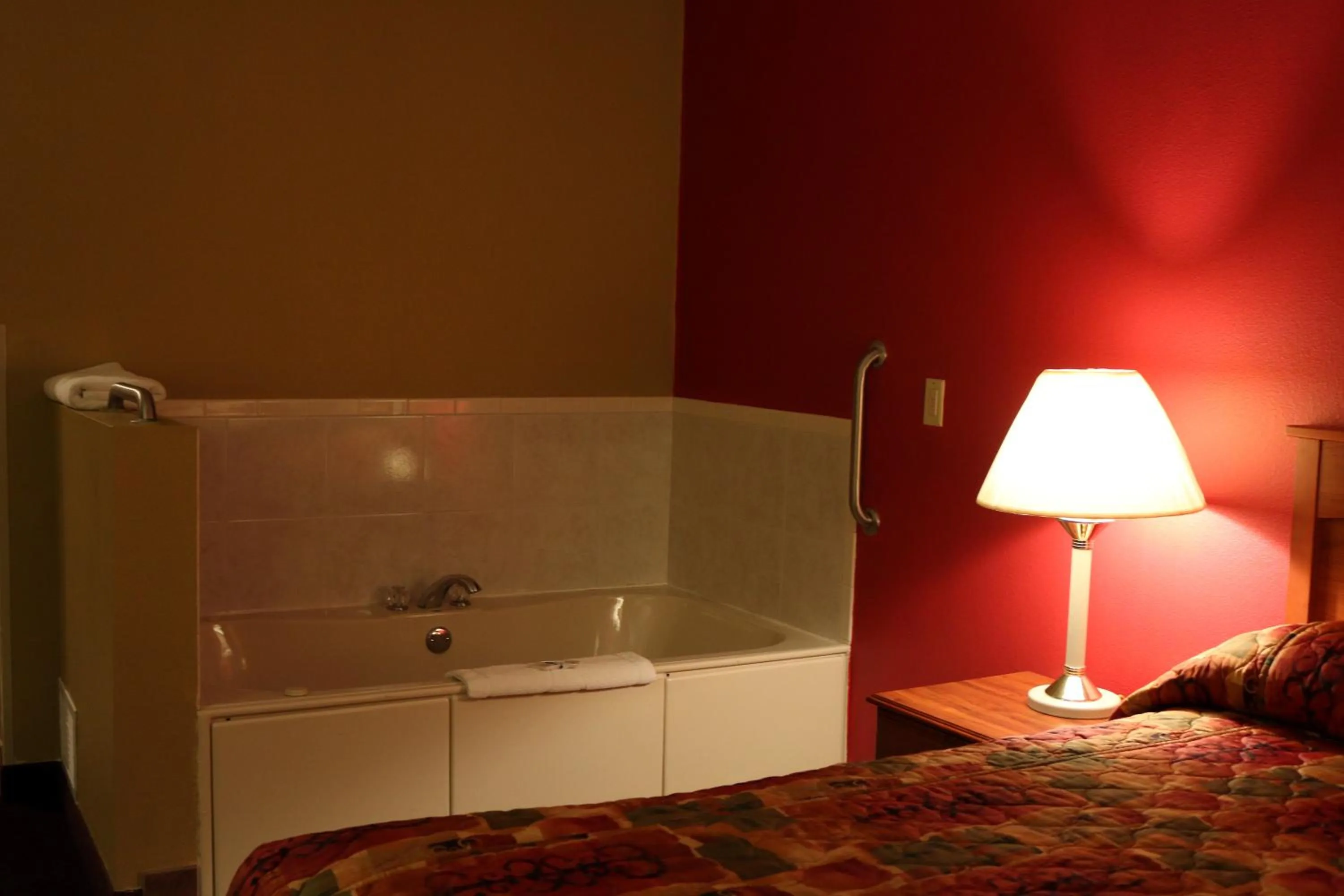 Bed in Hometown Inn & Suites